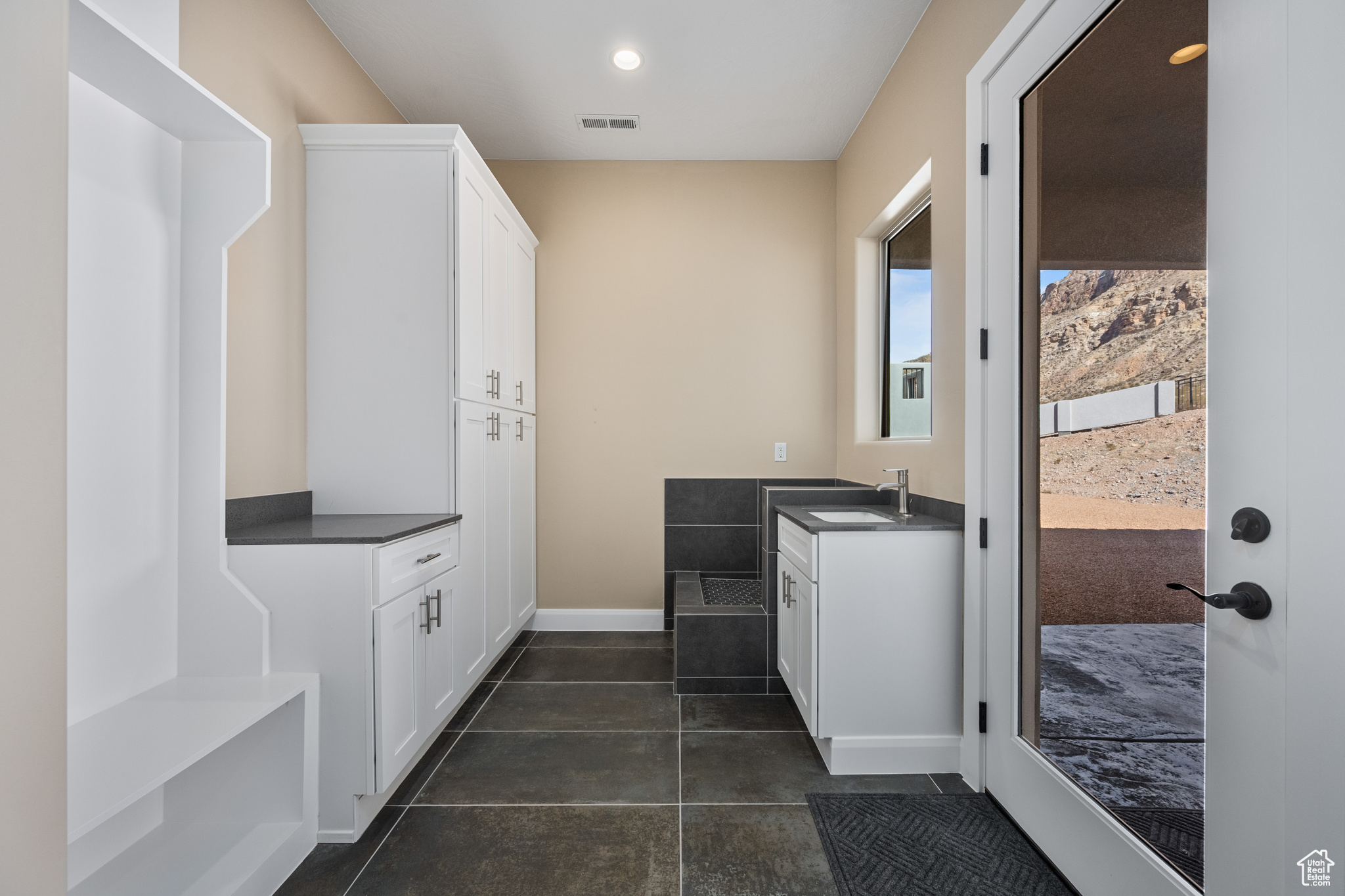 Clothes washing area featuring sink