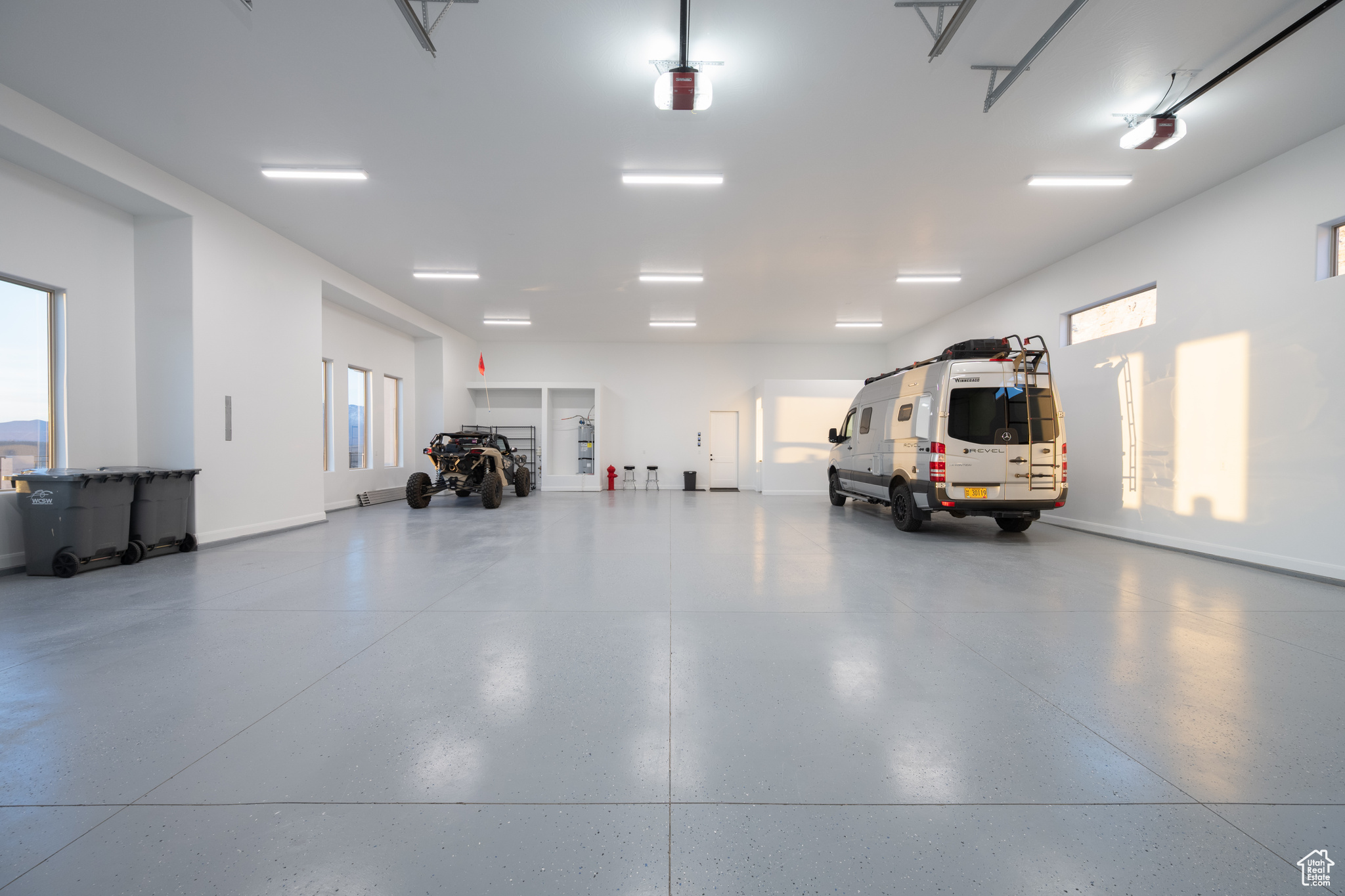 Garage featuring baseboards