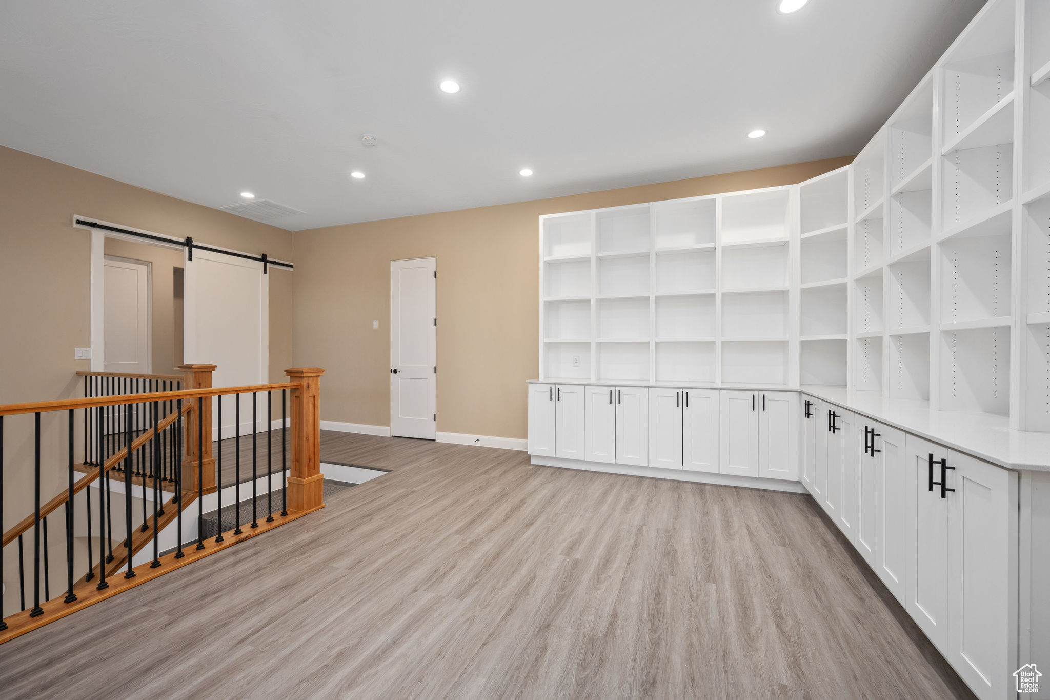 Interior space featuring light hardwood / wood-style flooring and a barn door