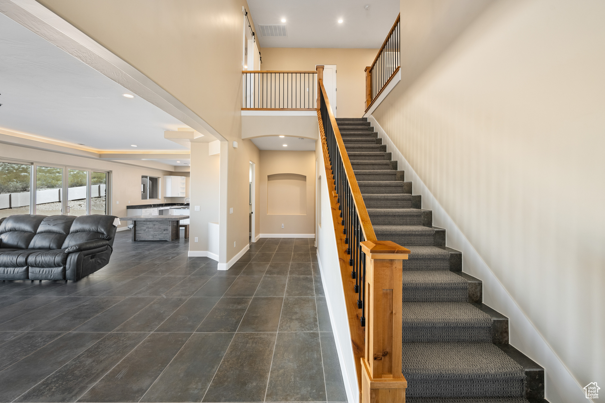 Stairs featuring a high ceiling