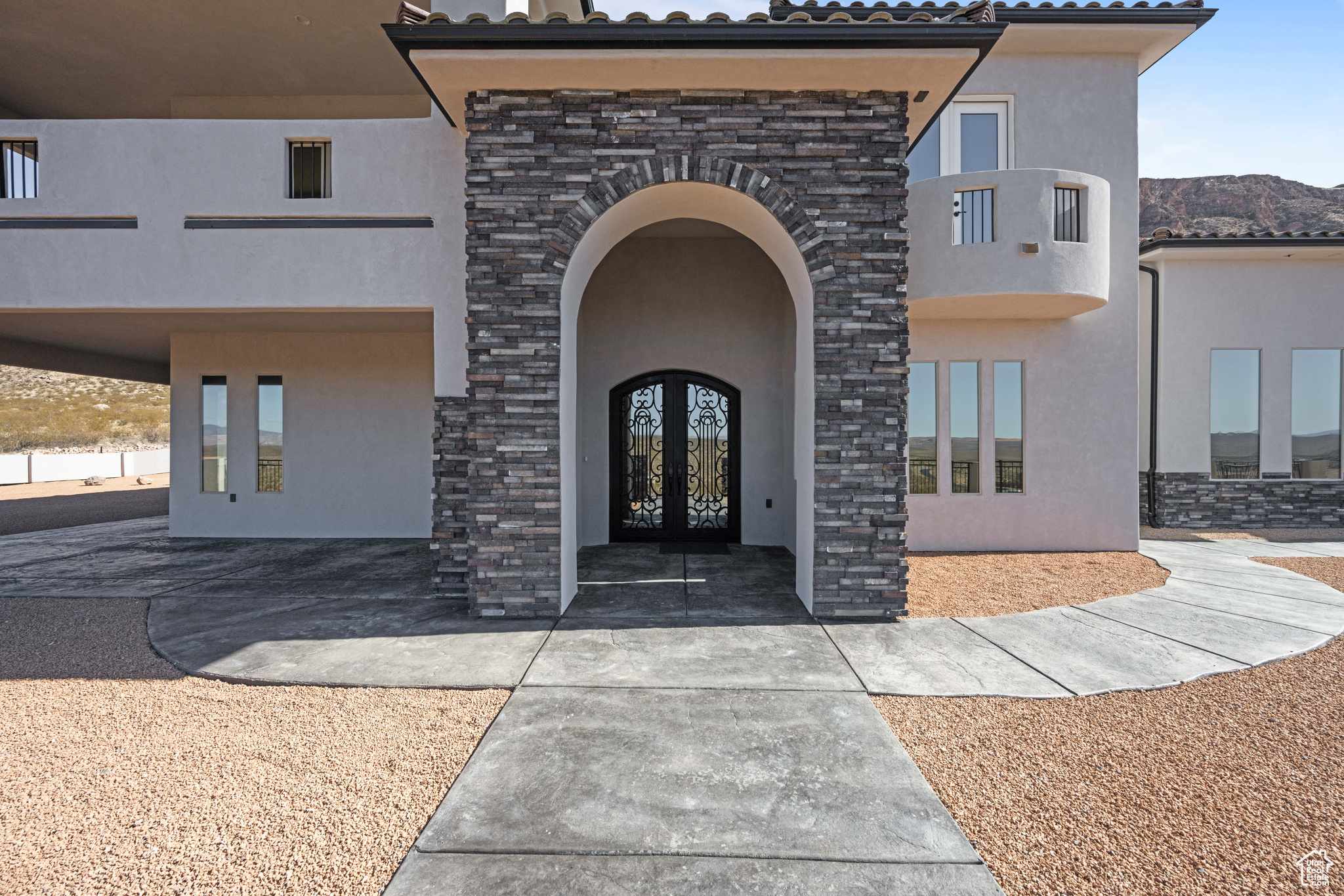 Doorway to property with a mountain view and french doors