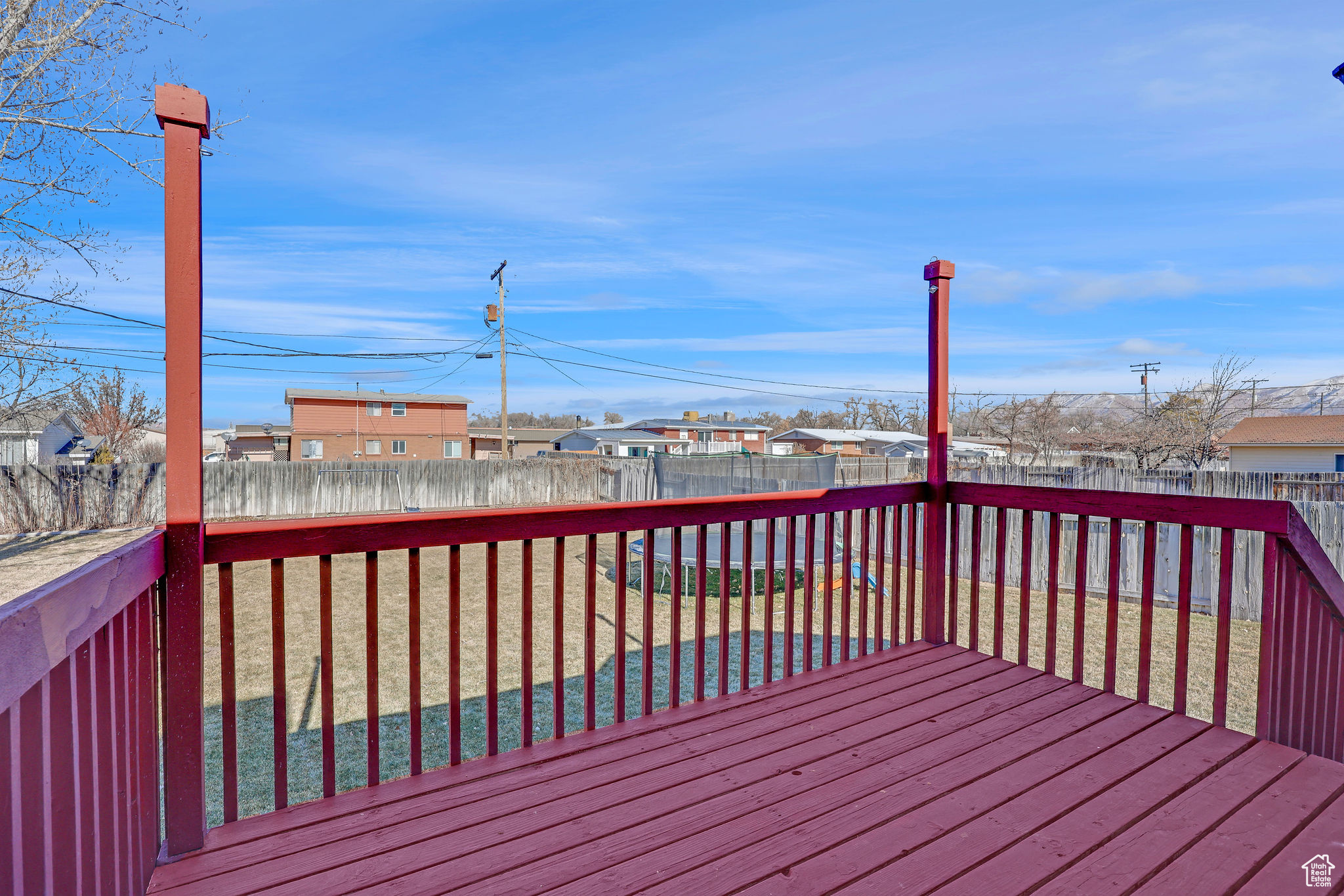 Deck overlooking the fenced in yard