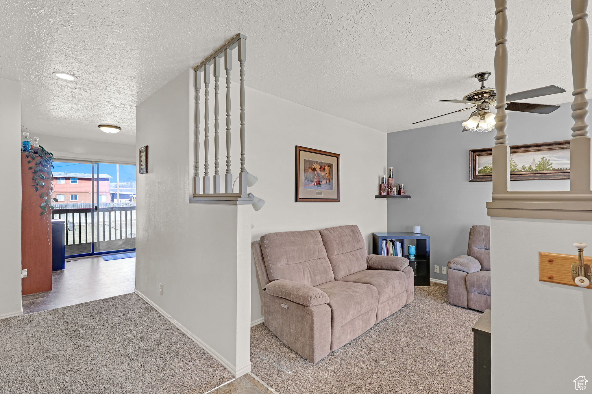 Living room and entry leading to the kitchen and dining area