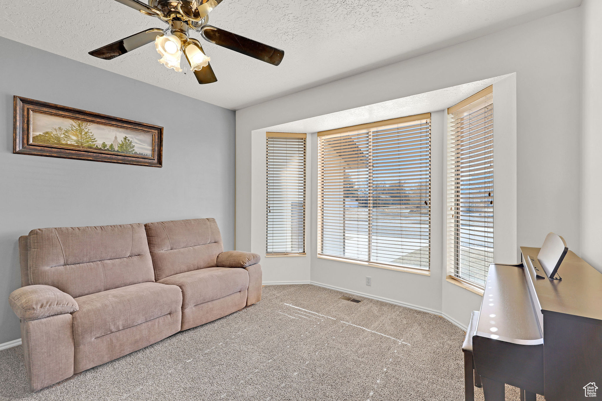 Living room with bay window offering natural light
