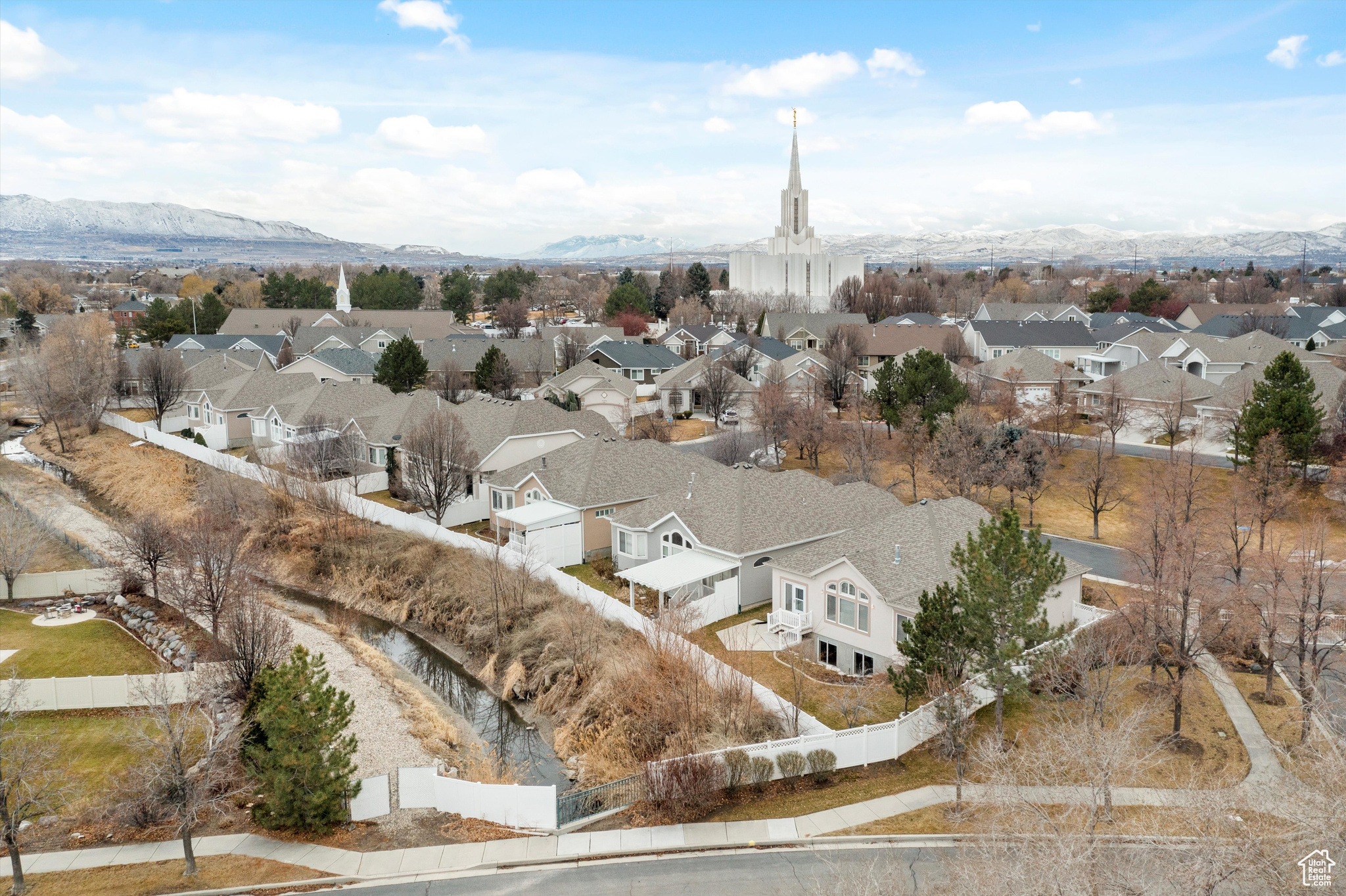 Birds eye view of the back of the property with a mountain view