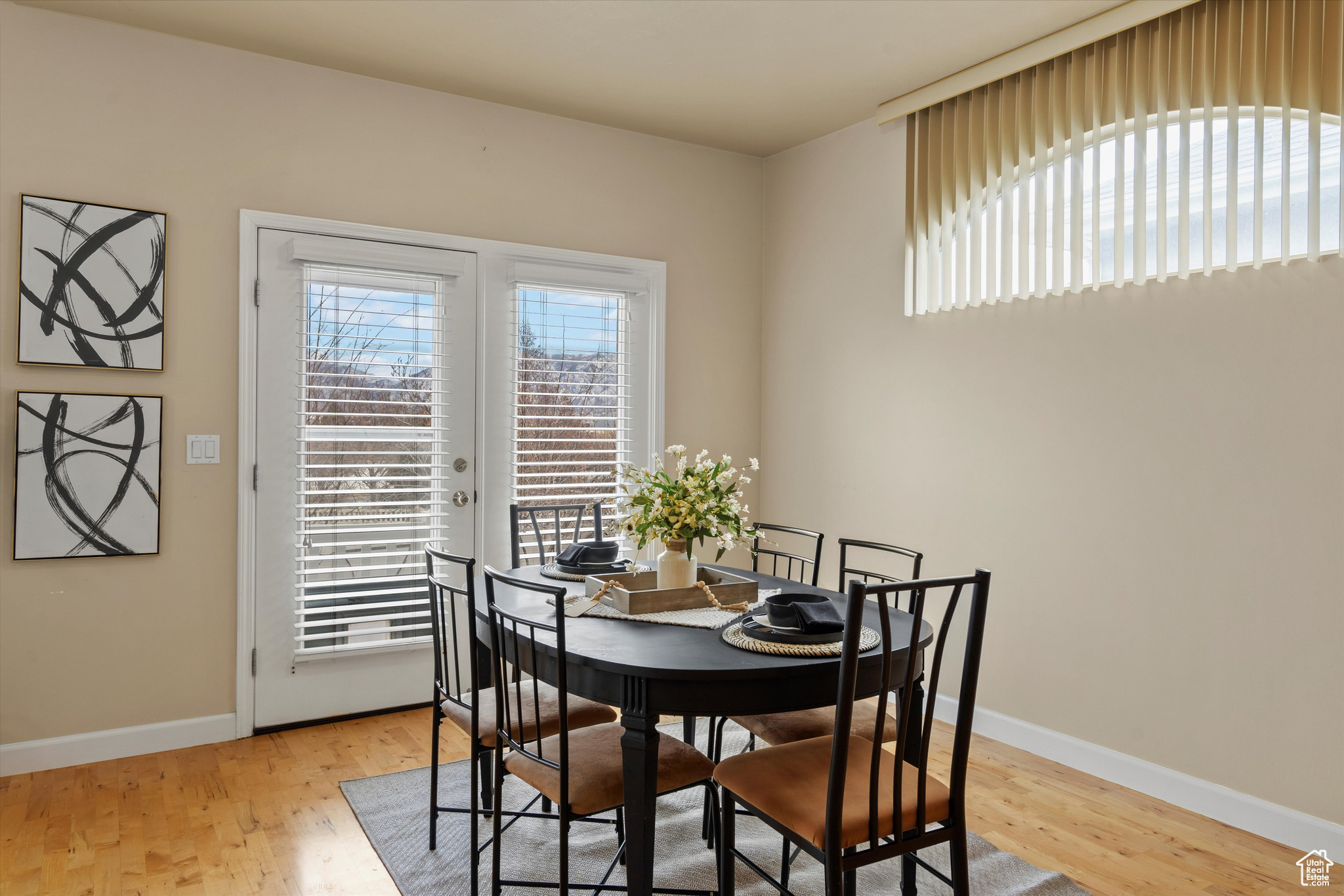 Dining area featuring french doors and light hardwood / wood-style flooring