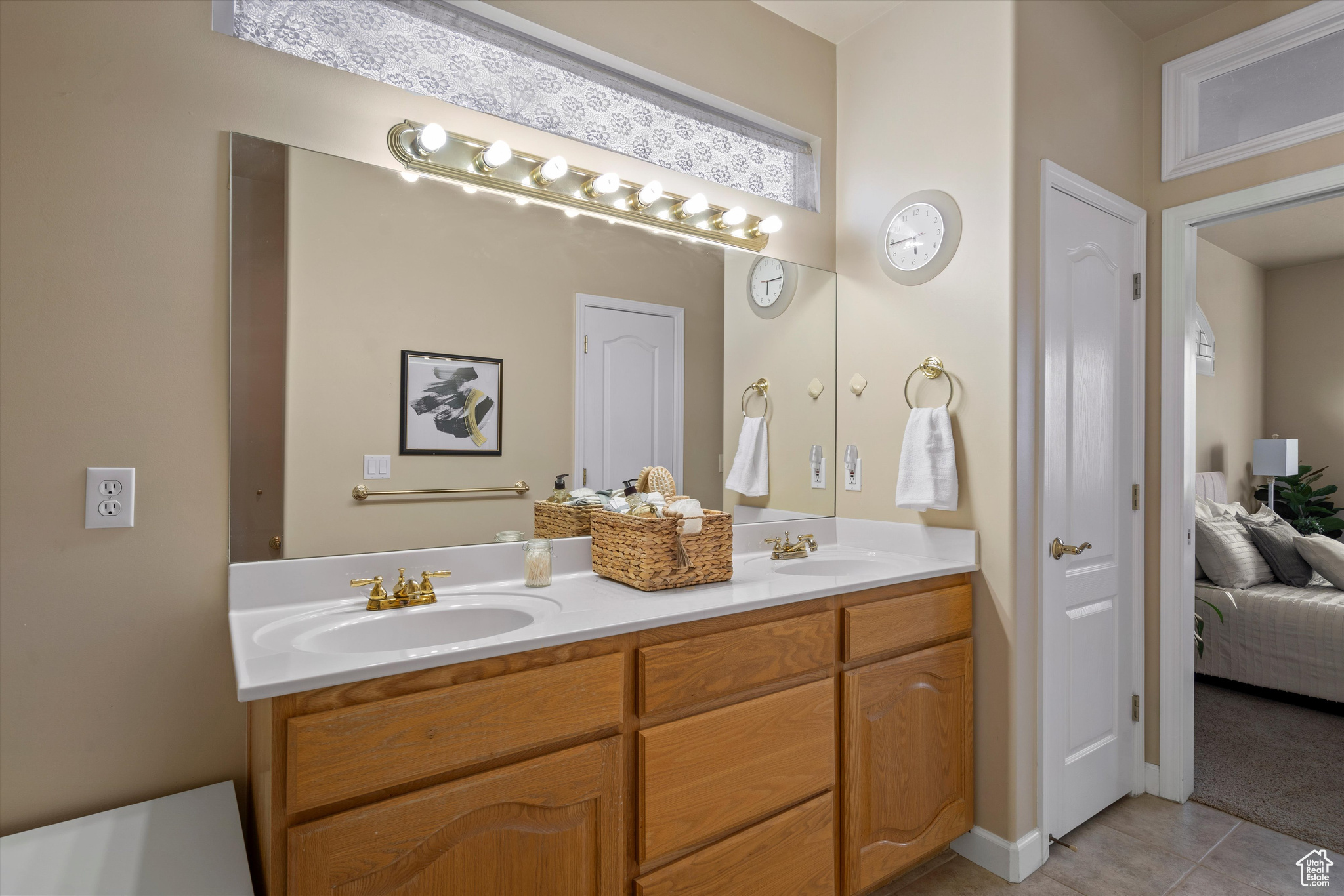 Bathroom featuring vanity and tile patterned flooring