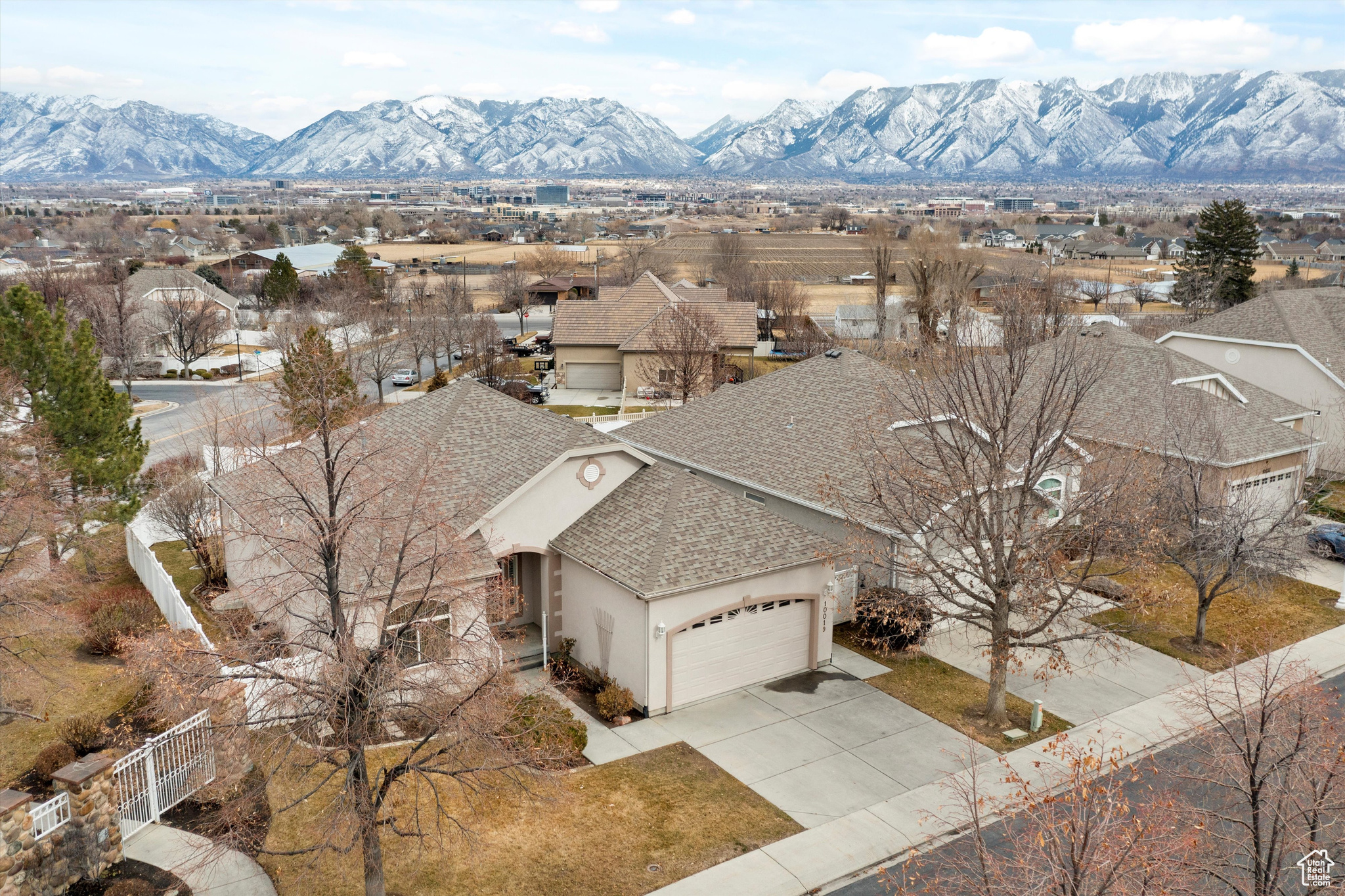 Drone / aerial view of the front of the home featuring a mountain view