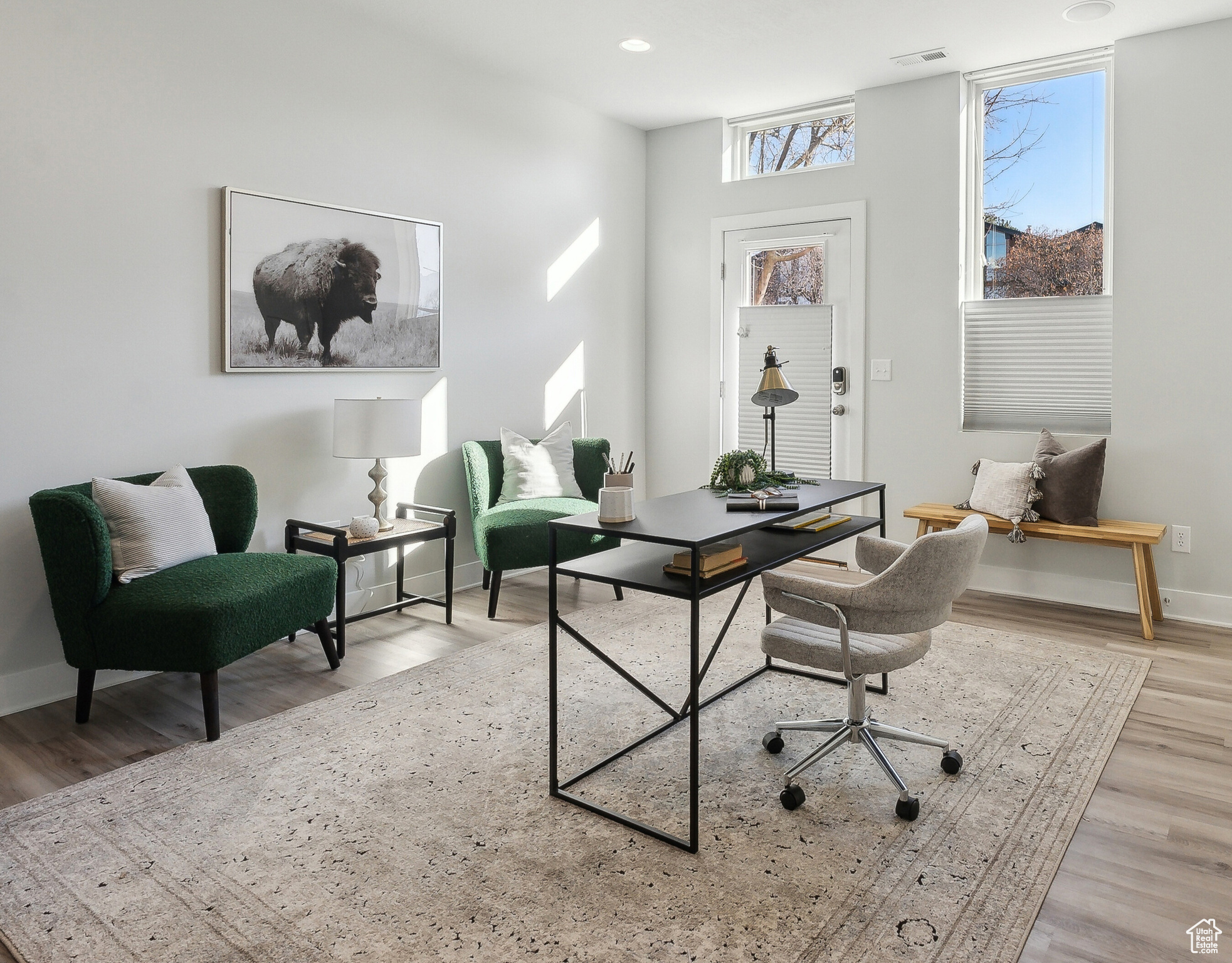 Home office with light wood-type flooring