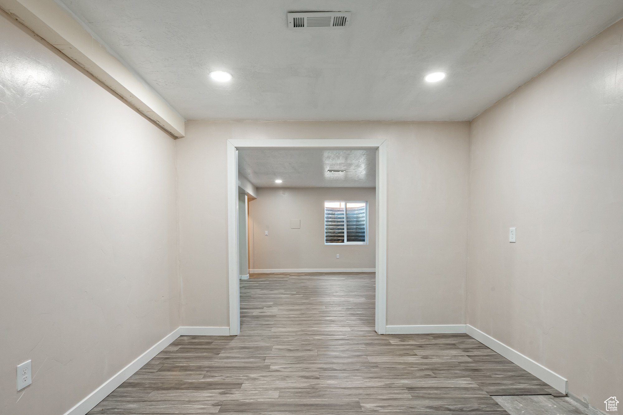 Unfurnished room with light wood-type flooring