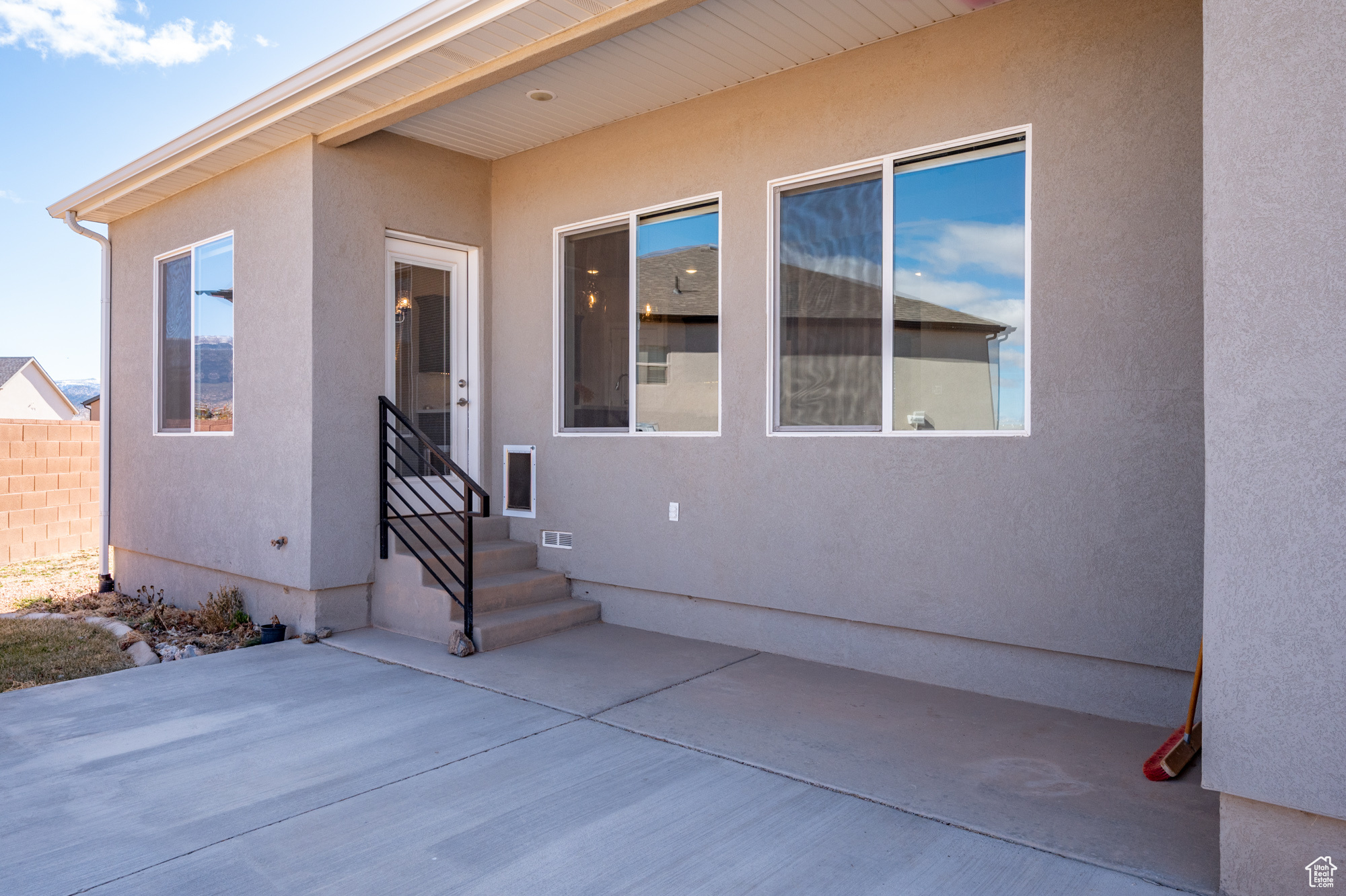 Property entrance featuring a patio area