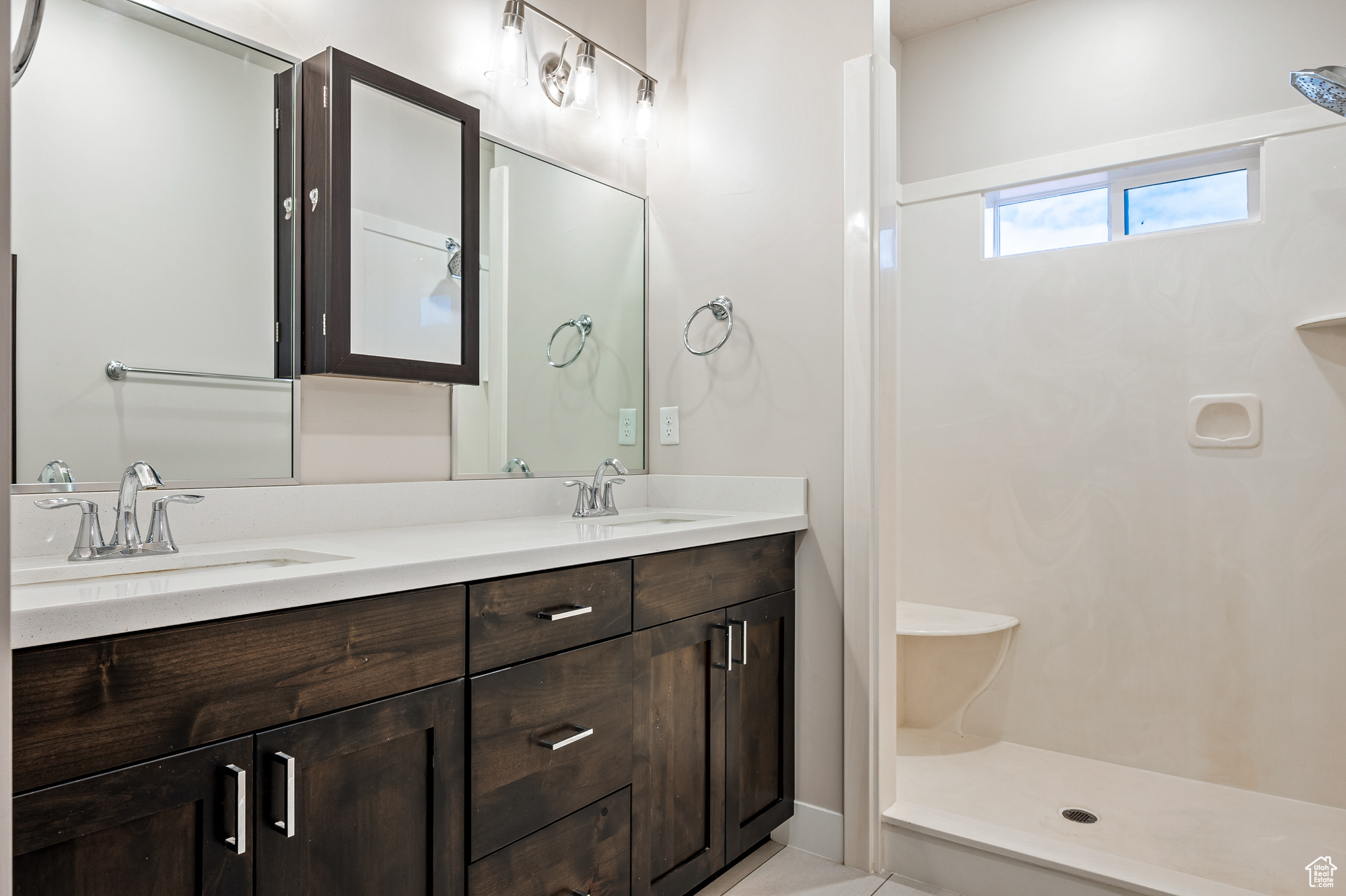 Bathroom featuring vanity and walk in shower