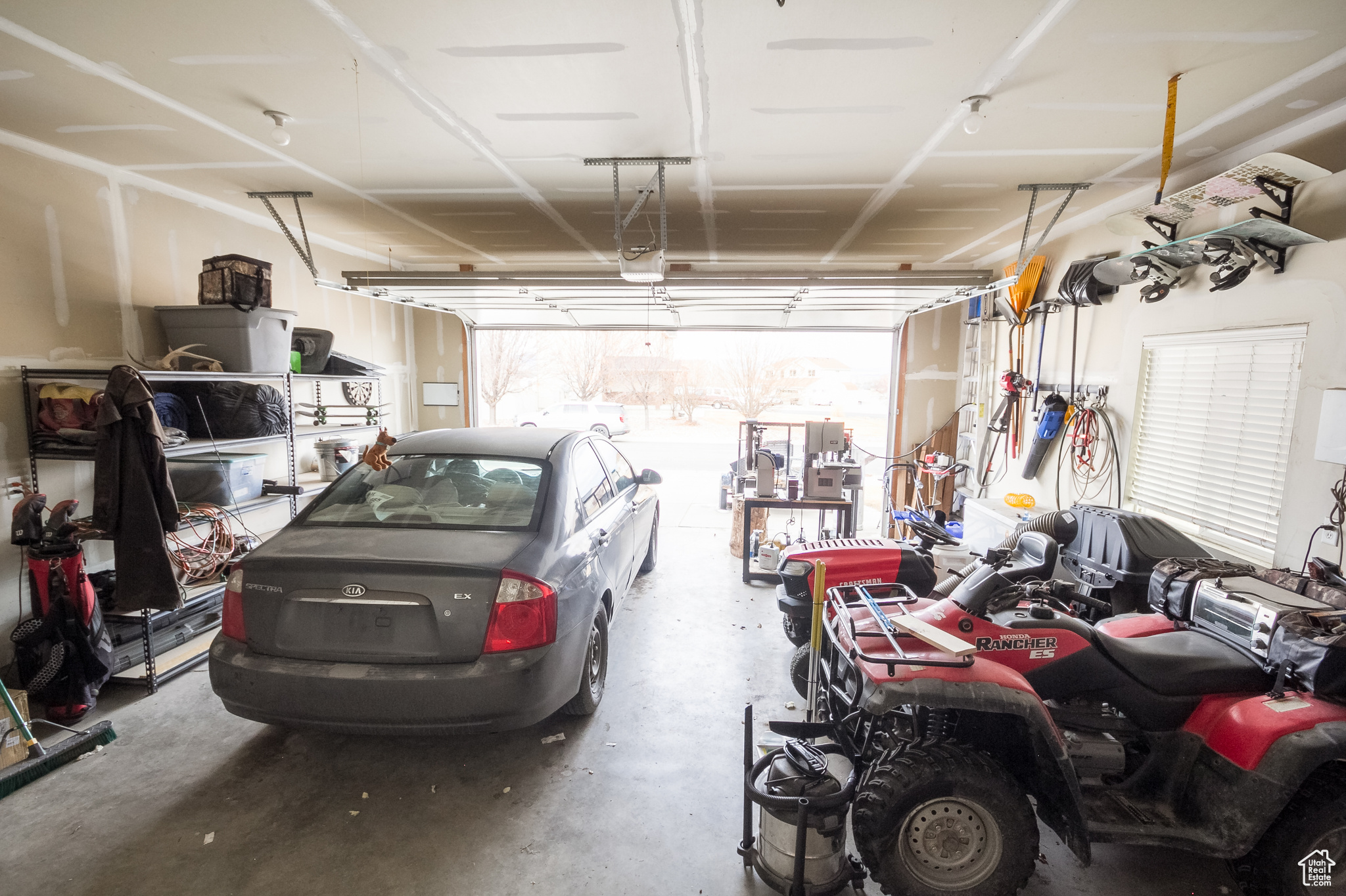Garage featuring a garage door opener