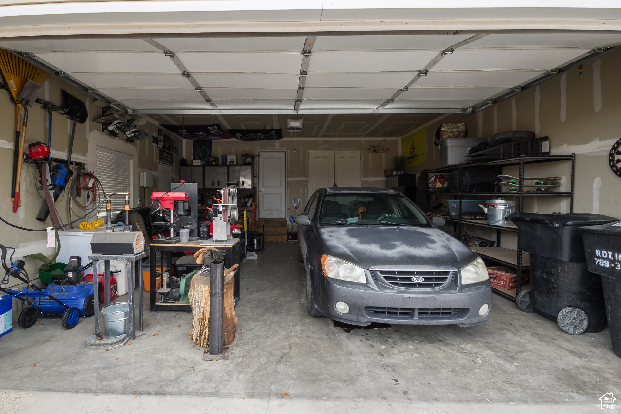 Garage featuring a garage door opener