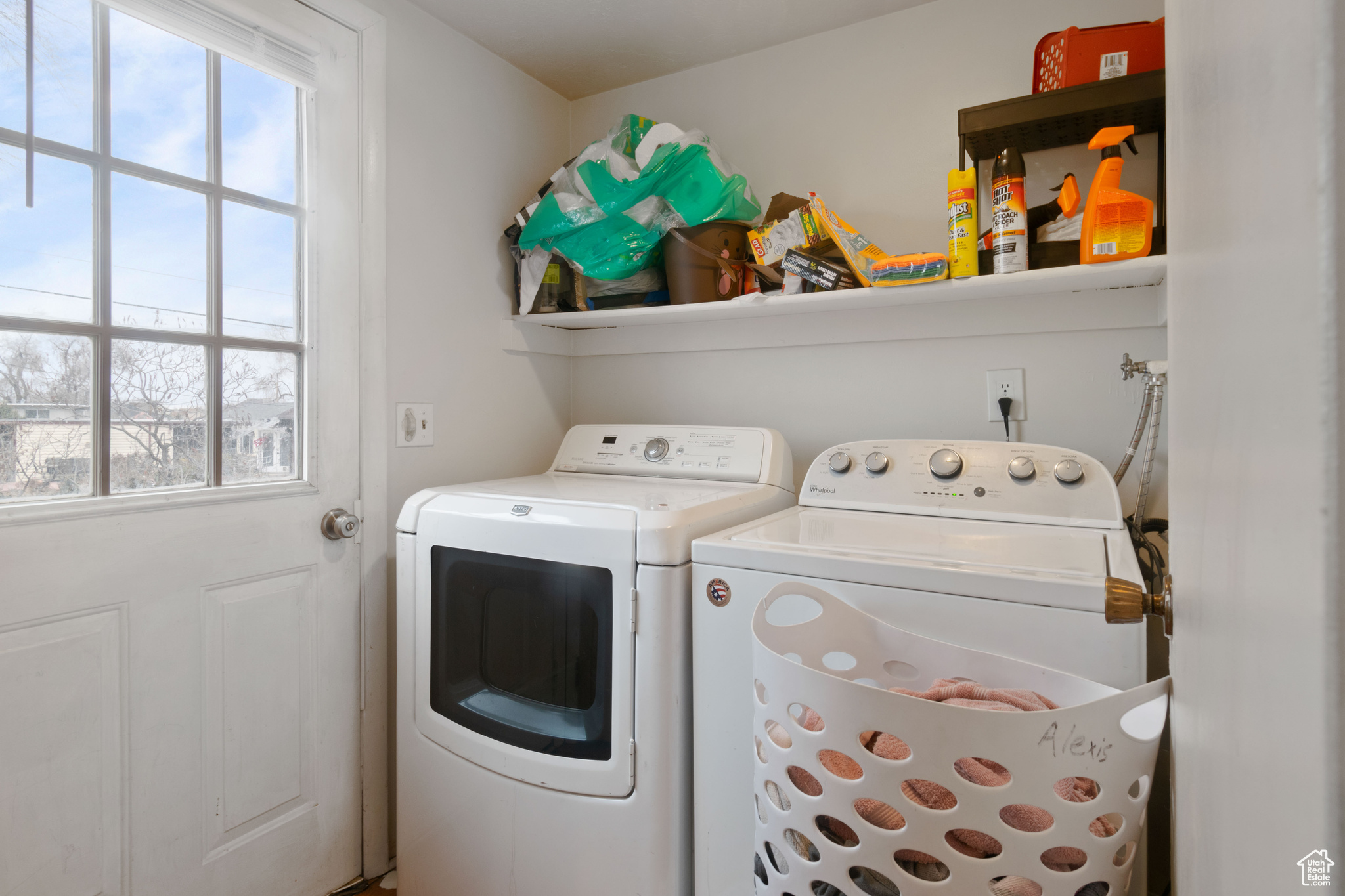 Laundry area featuring washing machine and dryer and laundry area