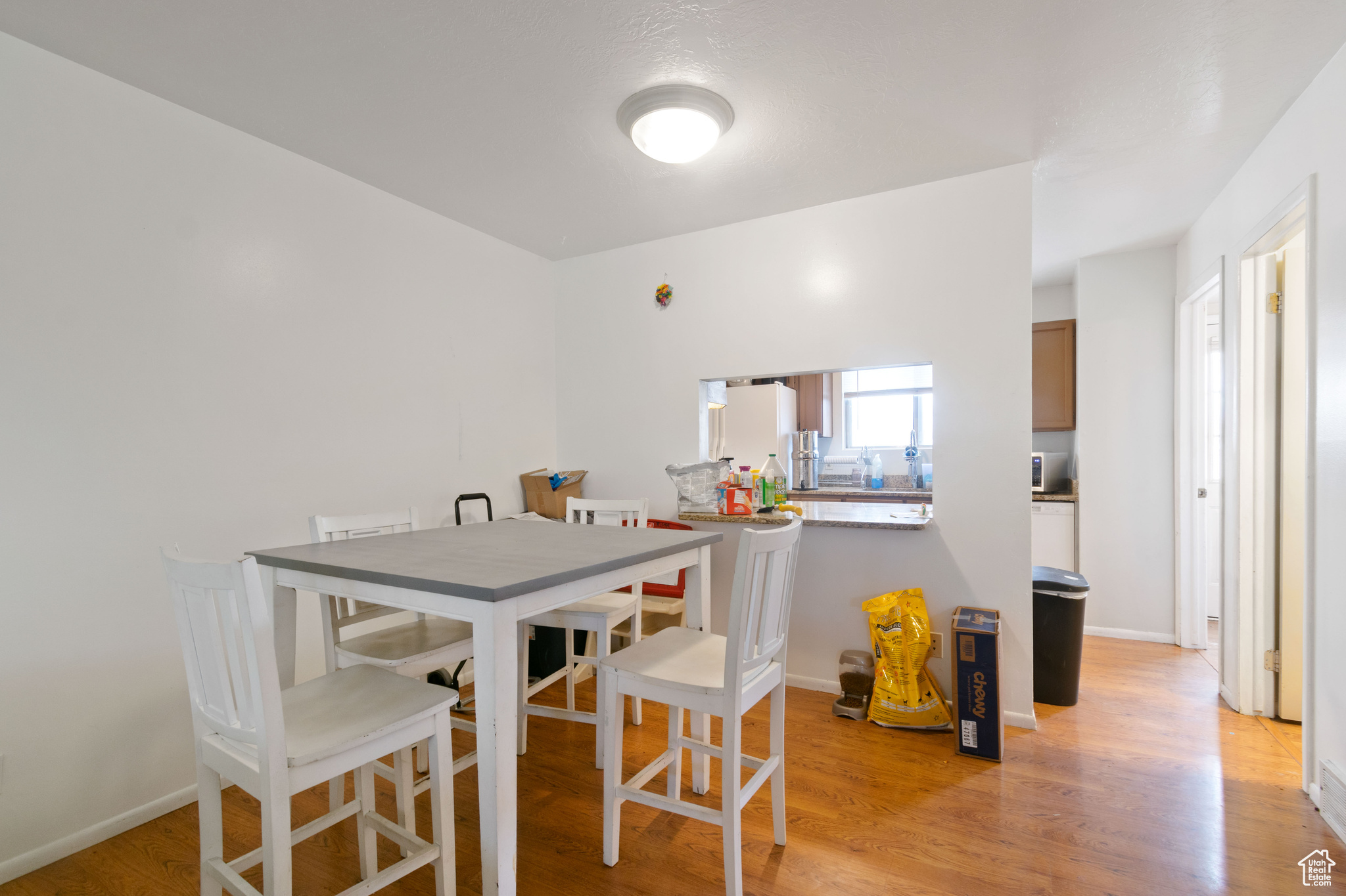 Dining space featuring baseboards and light wood finished floors