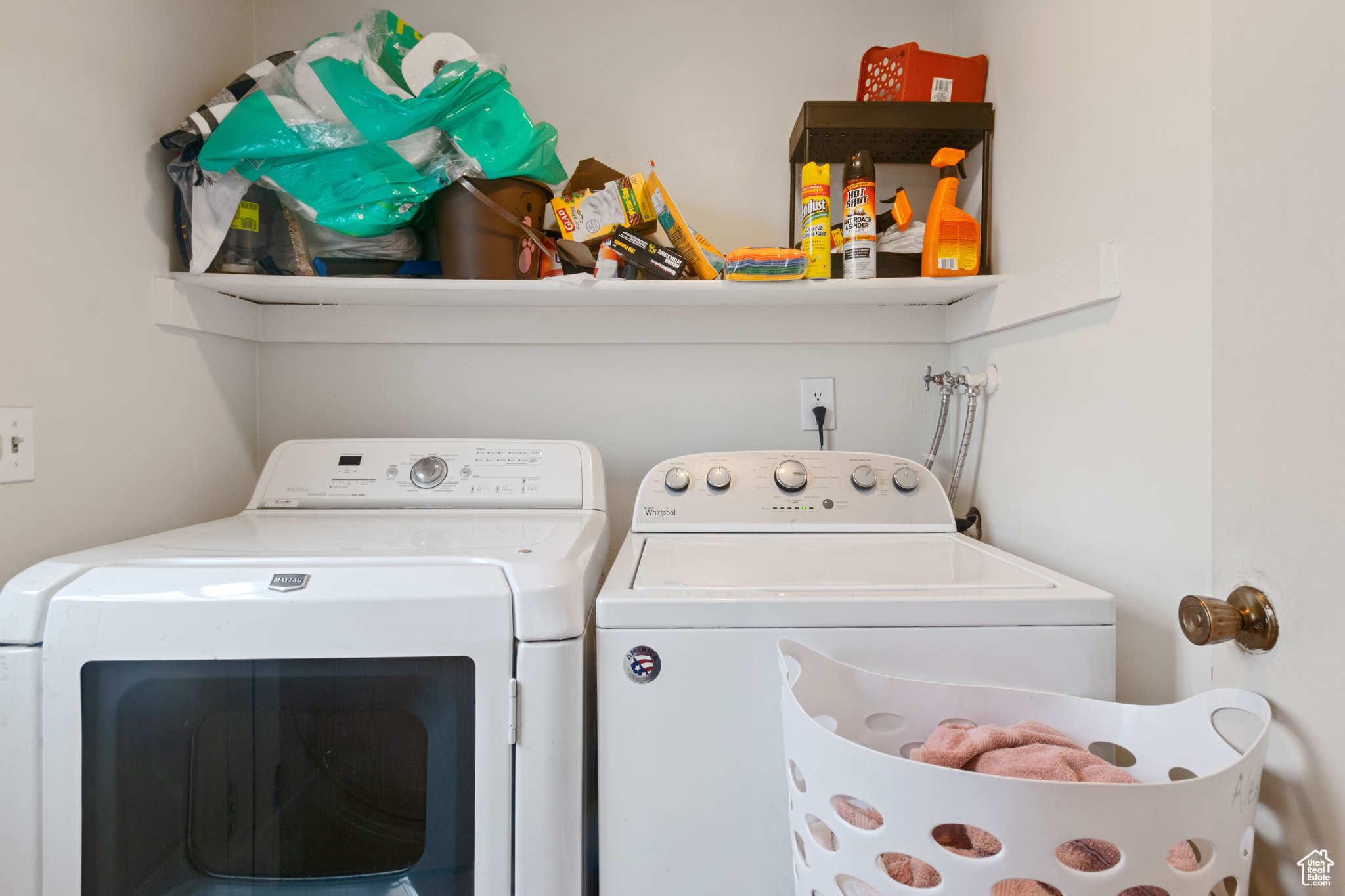 Washroom with washing machine and dryer and laundry area