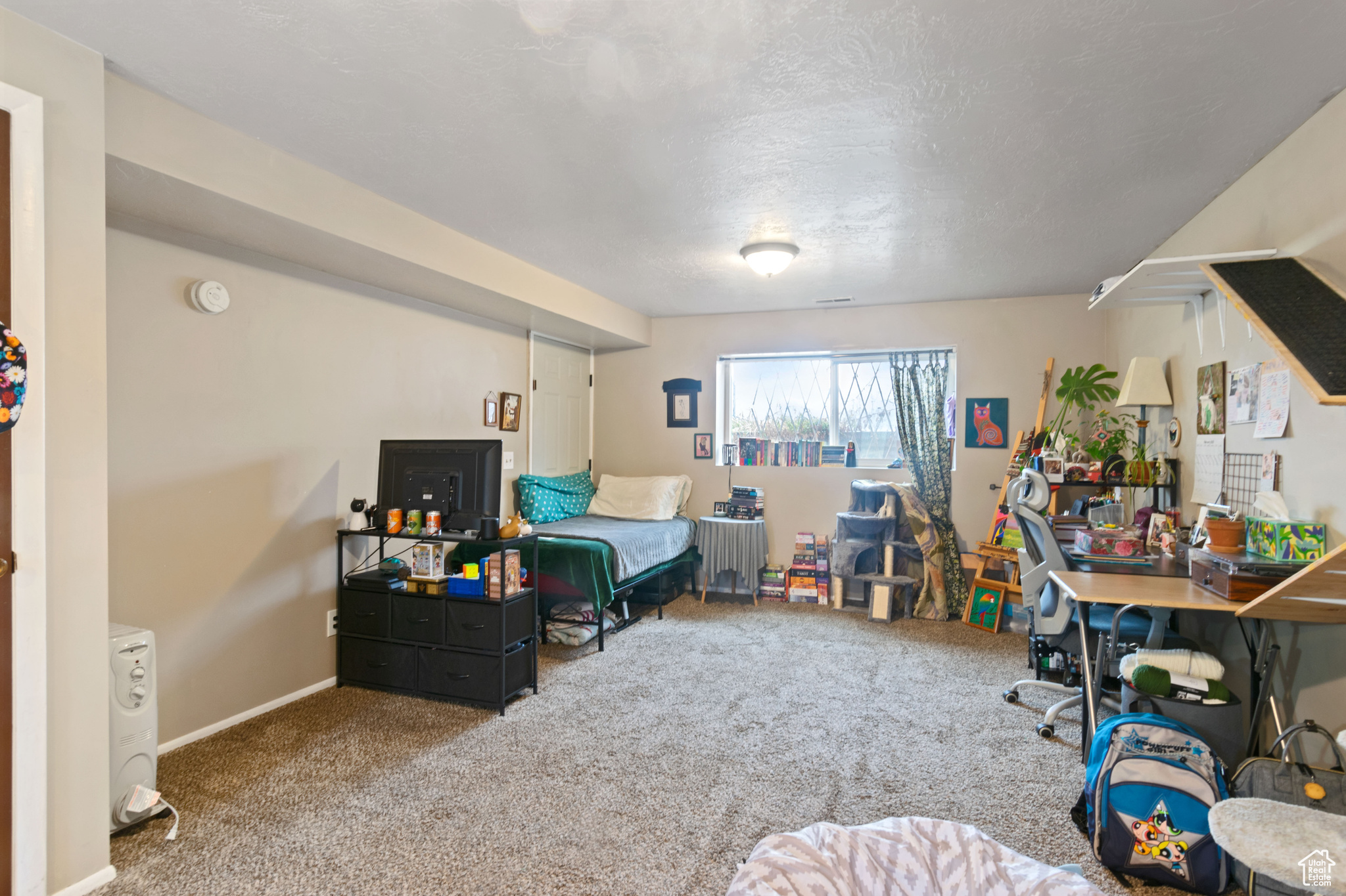 Interior space featuring baseboards and carpet floors