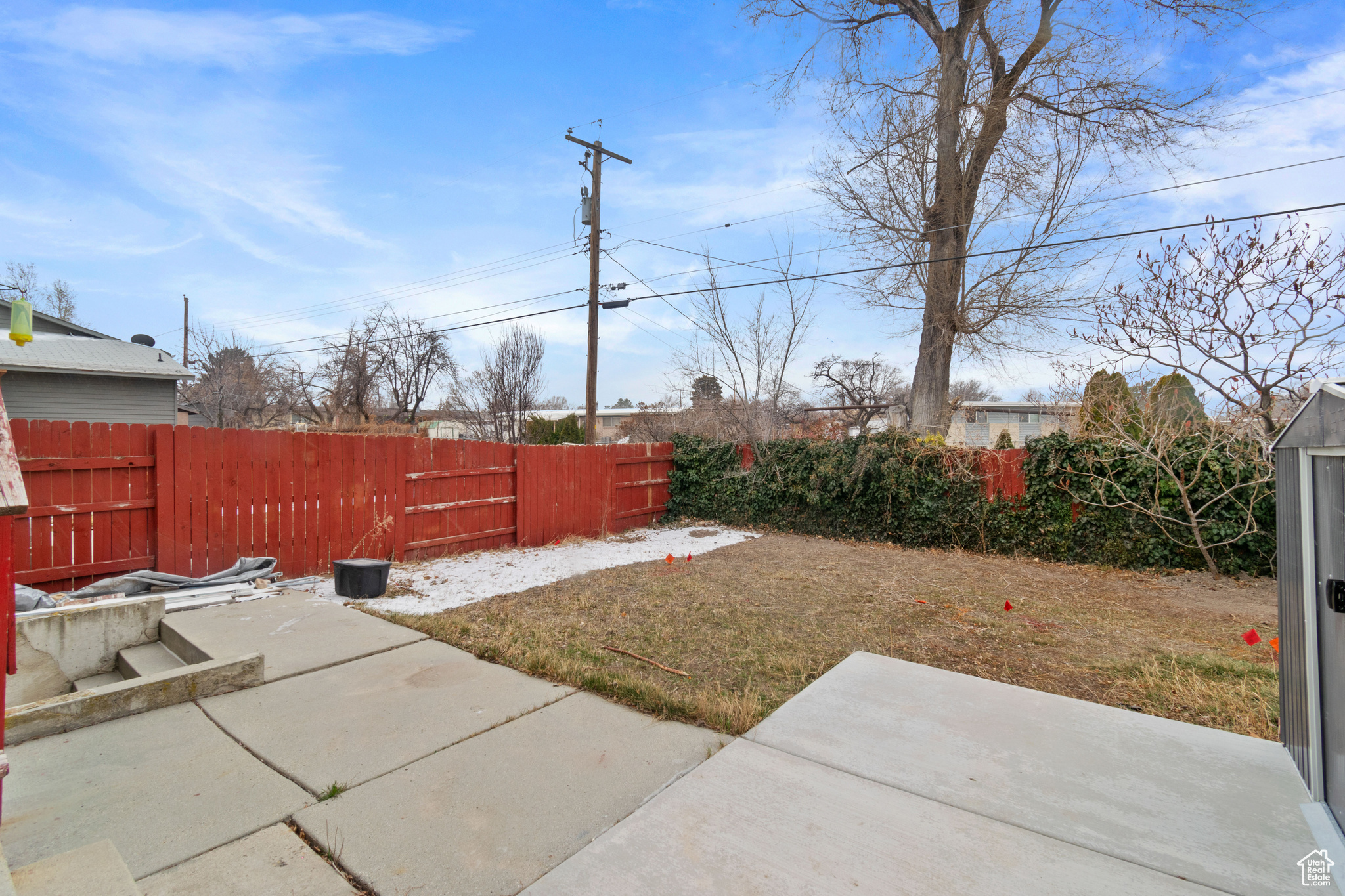 View of yard featuring a fenced backyard and a patio