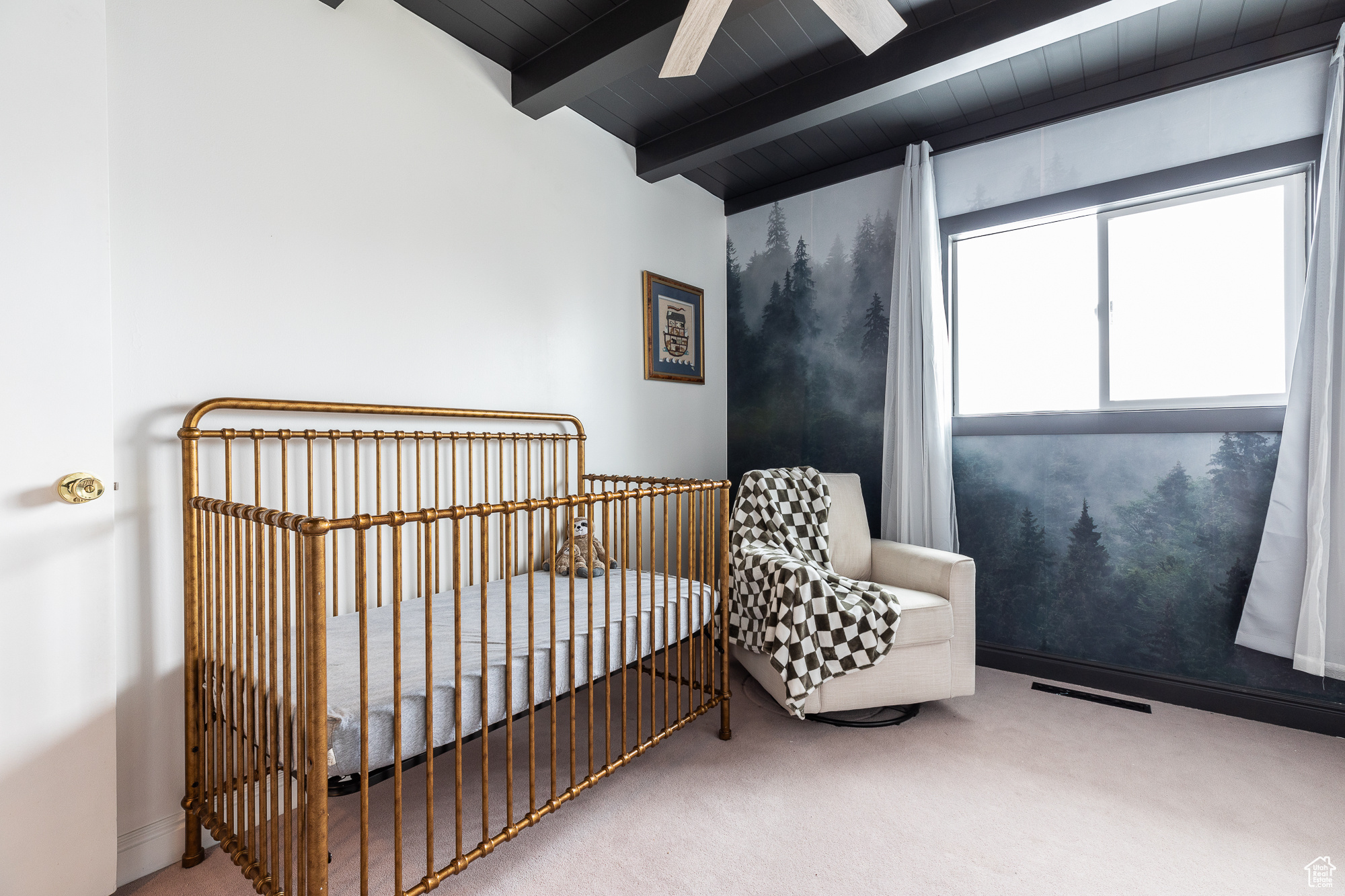 Bedroom with carpet flooring, a ceiling fan, visible vents, baseboards, and beamed ceiling