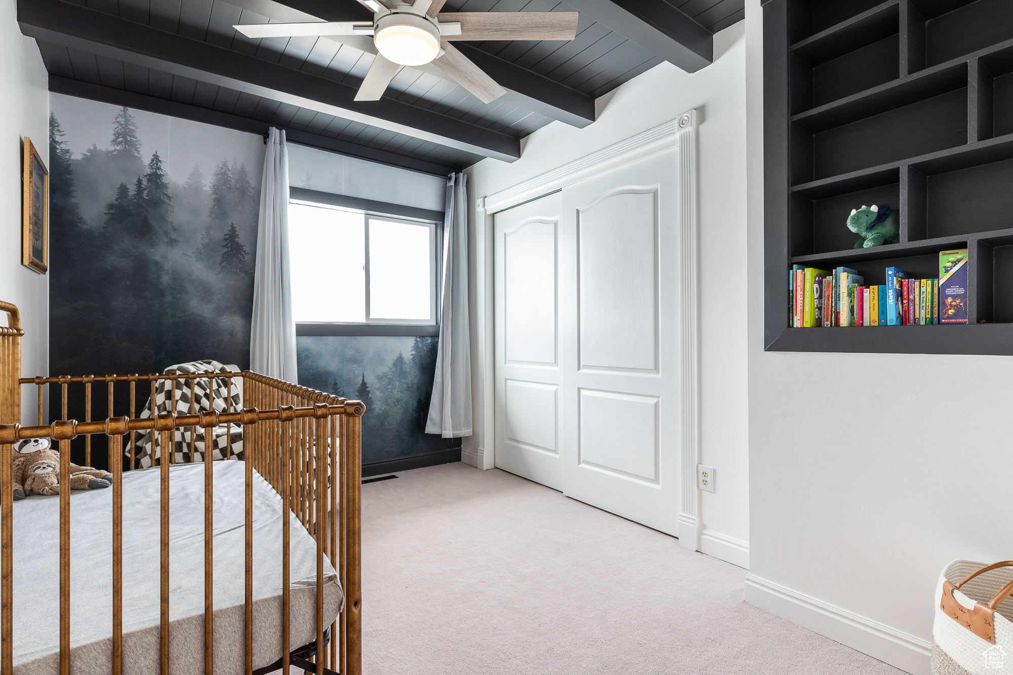 Bedroom featuring light carpet, baseboards, wooden ceiling, beamed ceiling, and a closet