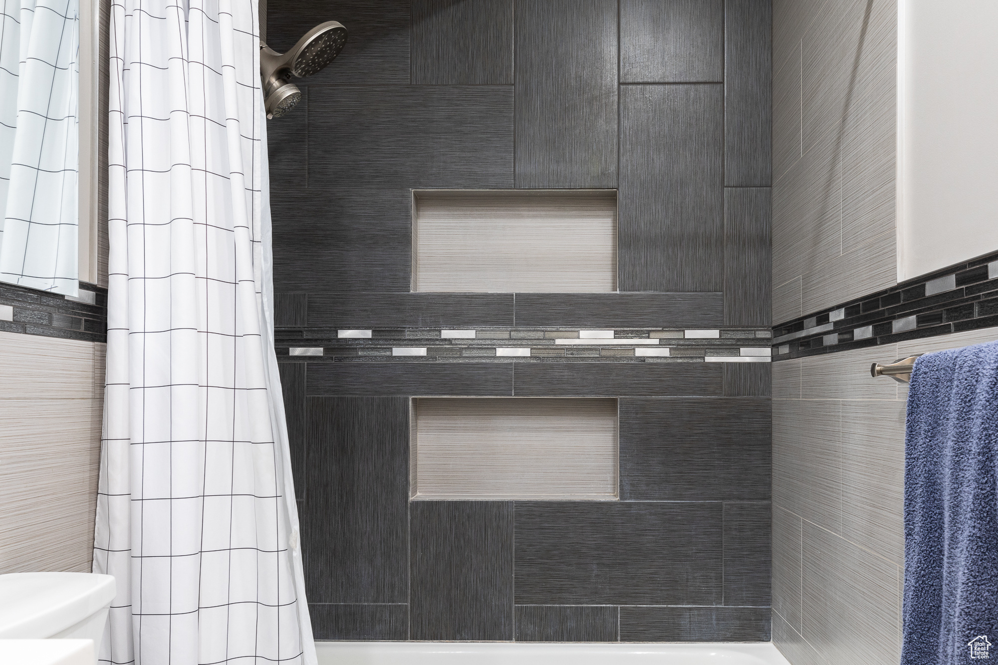 Bathroom with shower / bath combo and toilet
