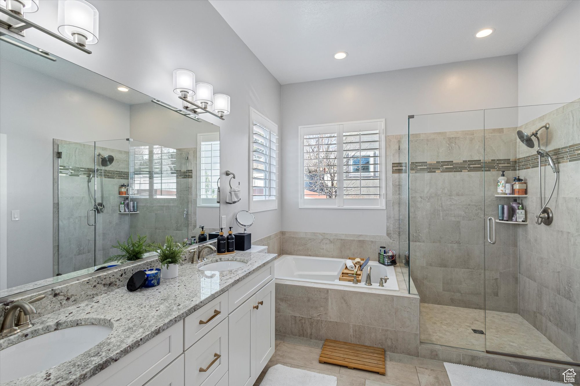 Bathroom with vanity and separate shower and tub