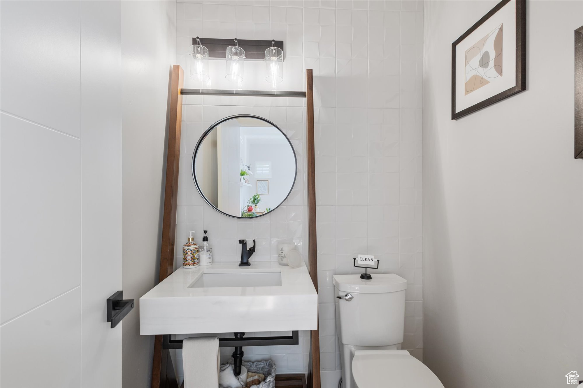 Bathroom with tile walls and toilet