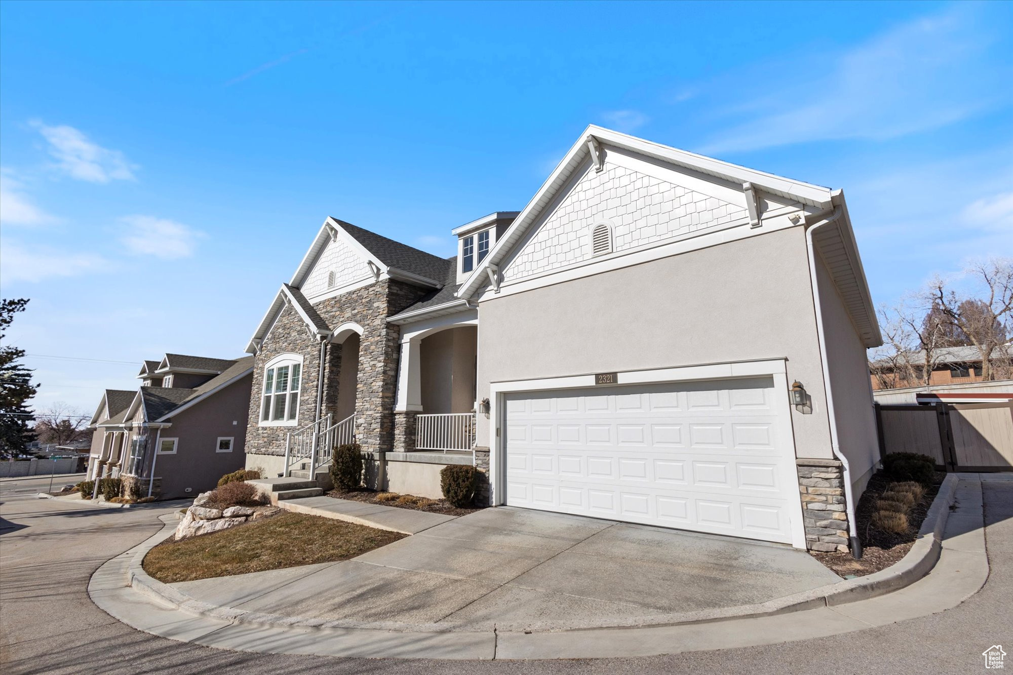 View of front facade featuring a garage