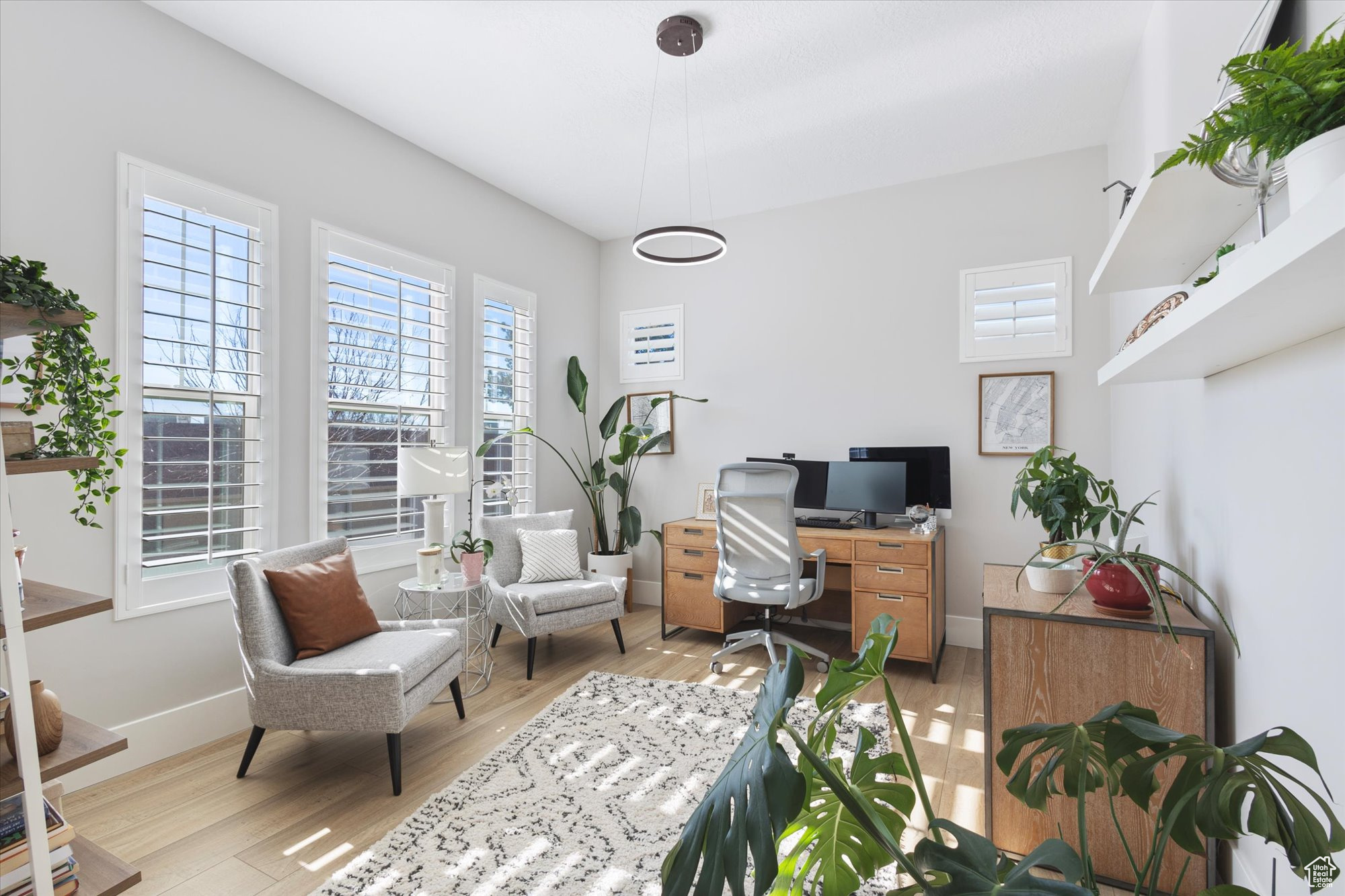 Office space featuring light hardwood / wood-style floors