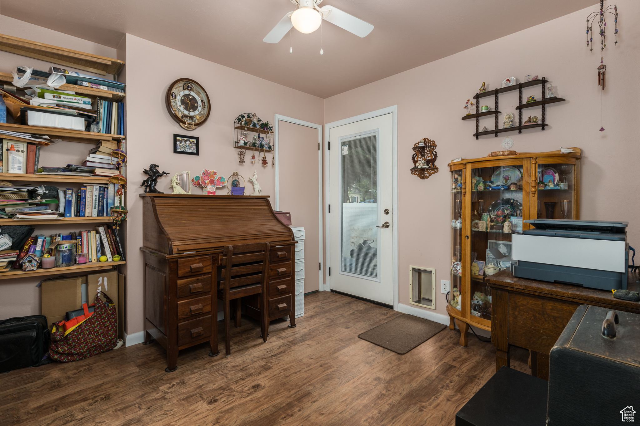 Office featuring dark wood-style floors, ceiling fan, and baseboards