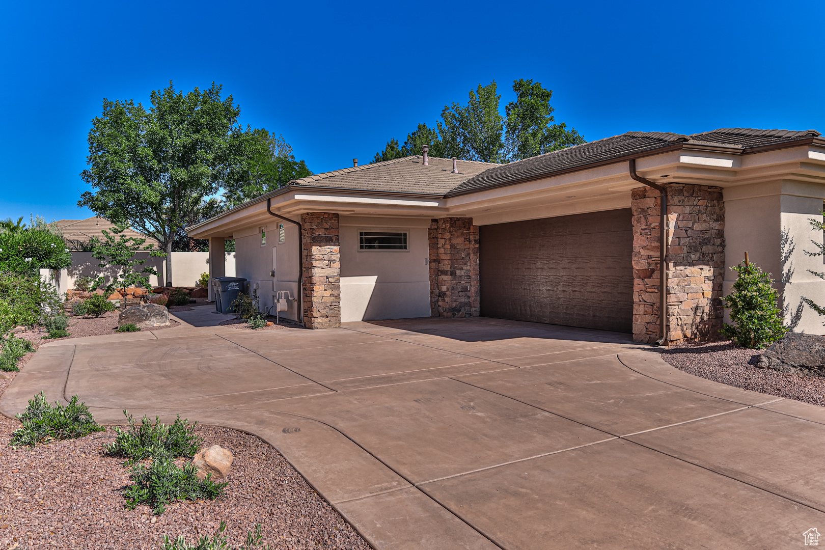 View of property exterior featuring a garage