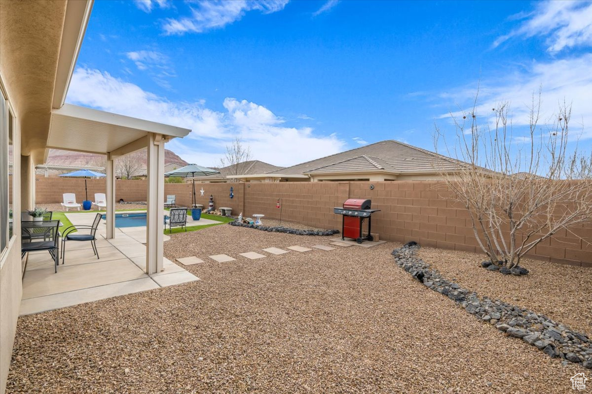 View of yard with a patio area and a fenced backyard