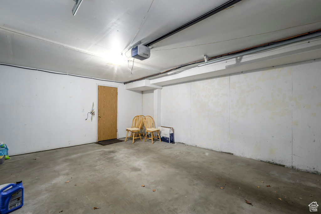Garage featuring a garage door opener