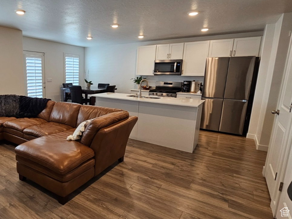 Open floor plan with light hardwood / wood-style flooring