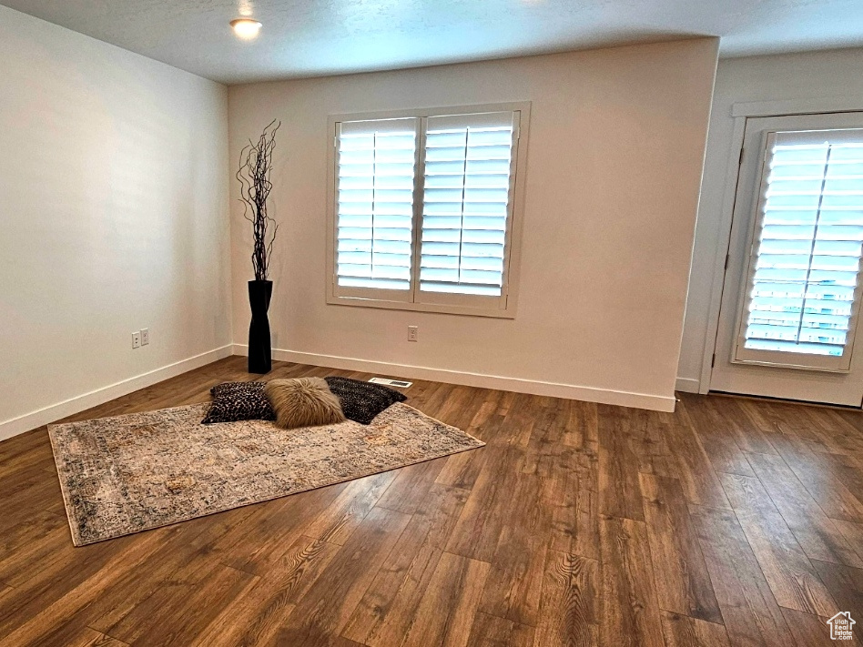 Interior space featuring wood finished floors and baseboards