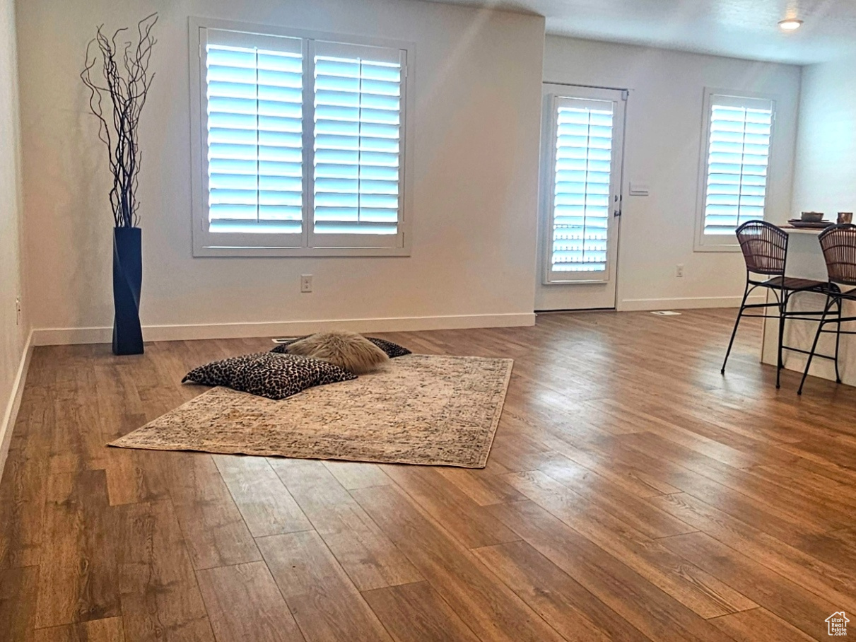 Interior space with wood finished floors and baseboards