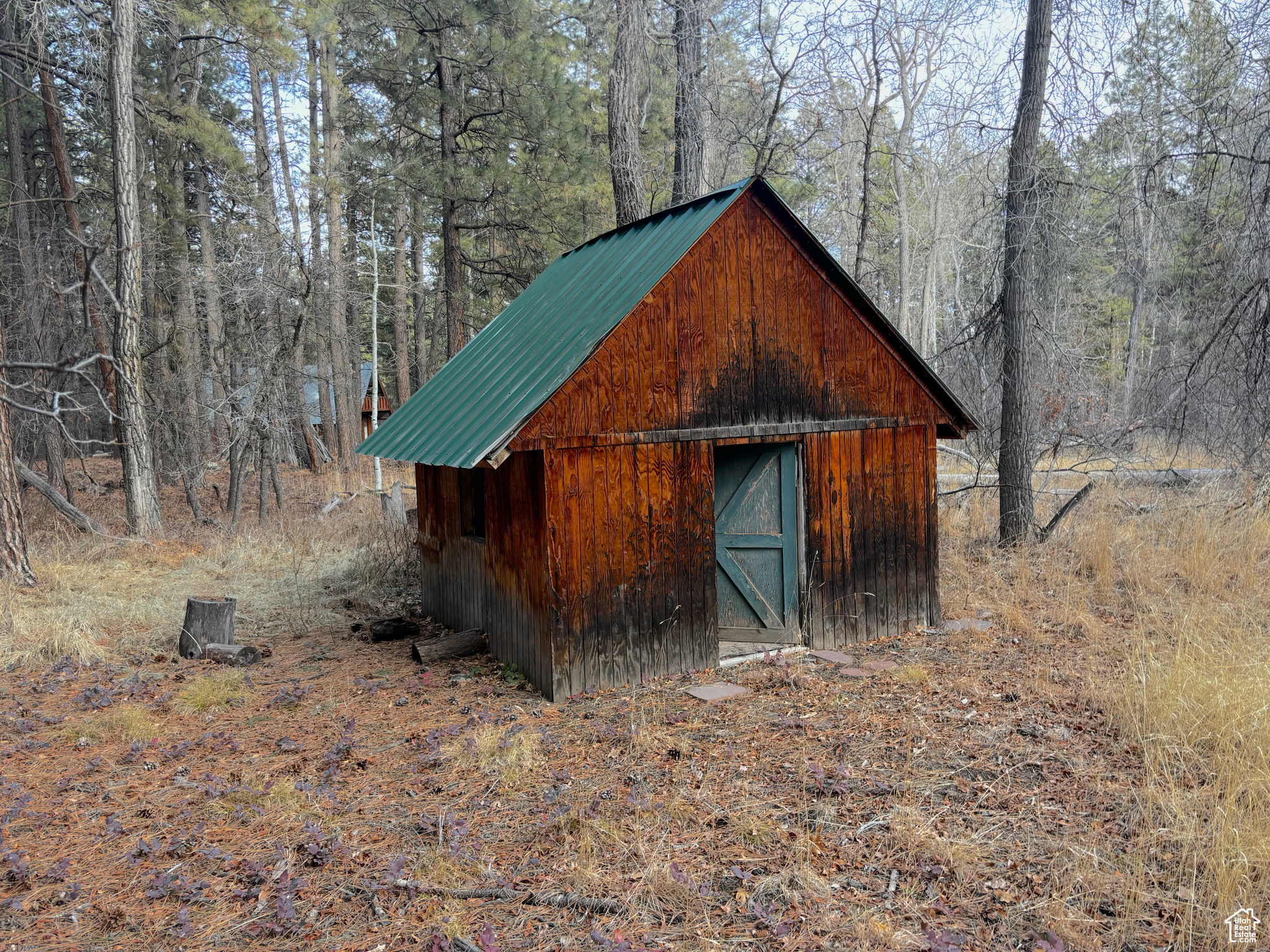 View of outbuilding with an outdoor structure