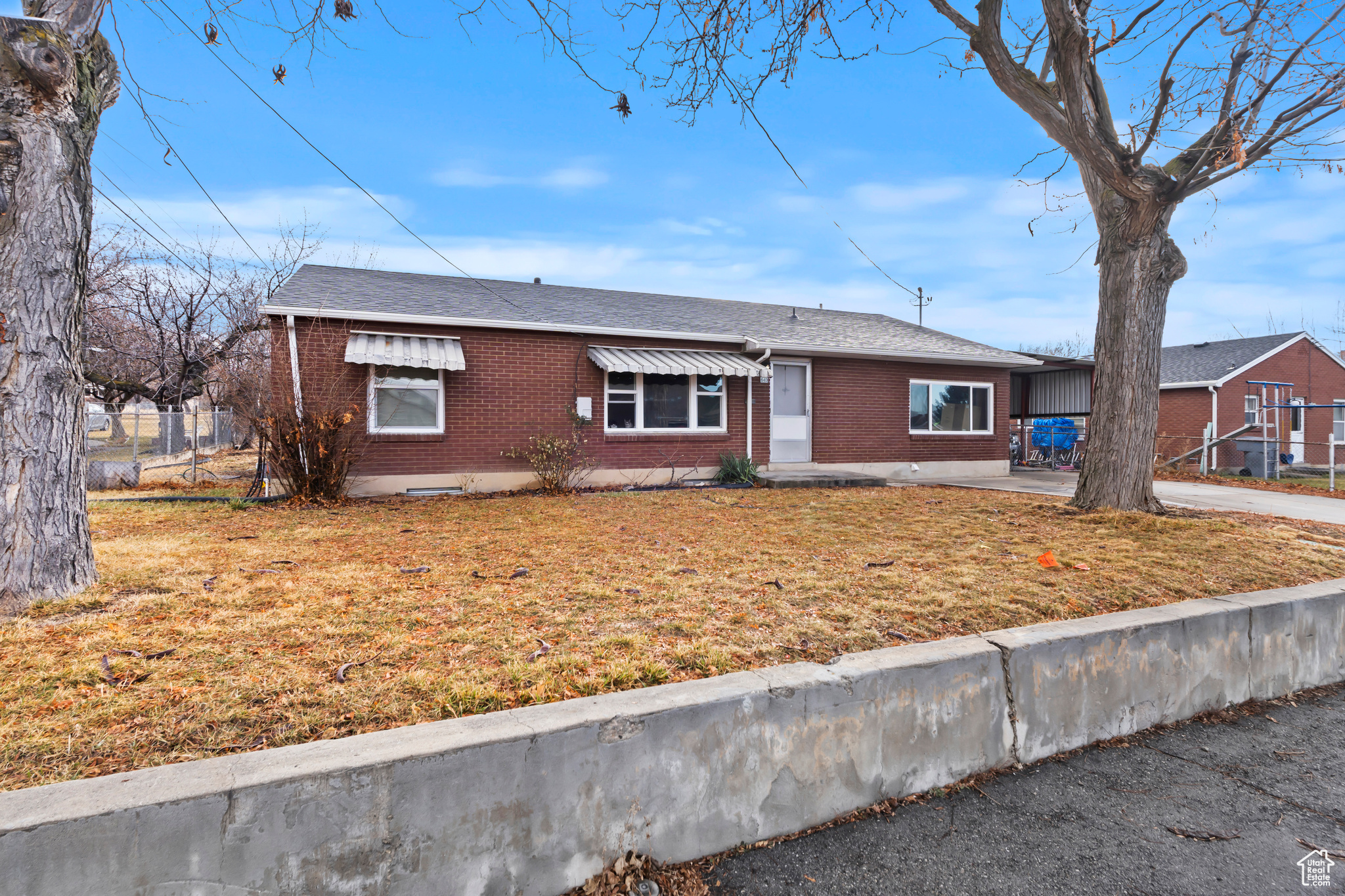 All brick exterior featuring a brand new roof