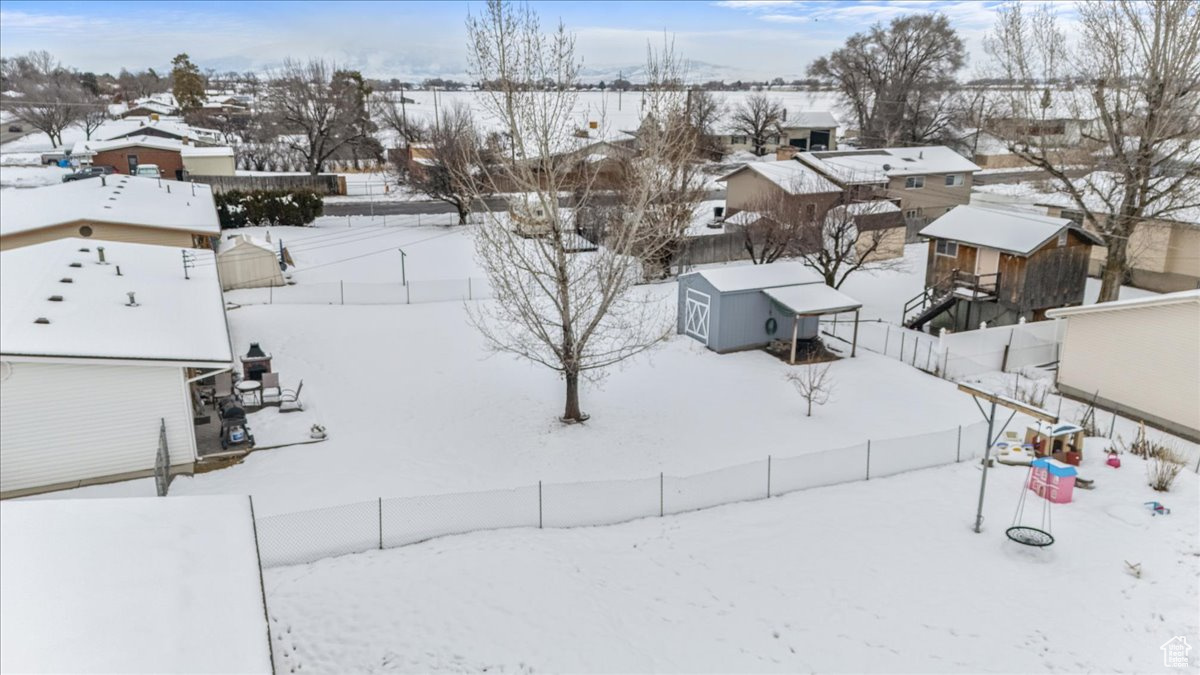 Snowy aerial view with a residential view