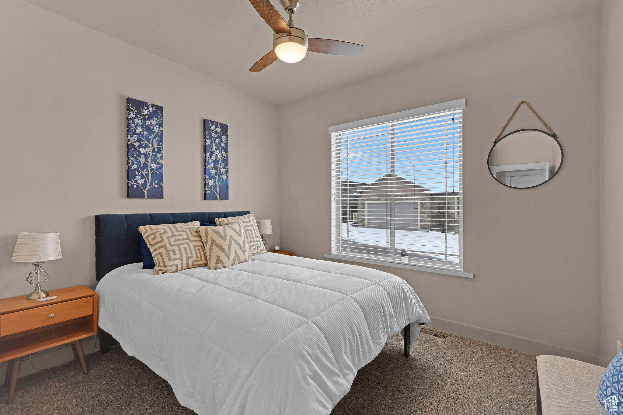 Bedroom with carpet flooring and ceiling fan