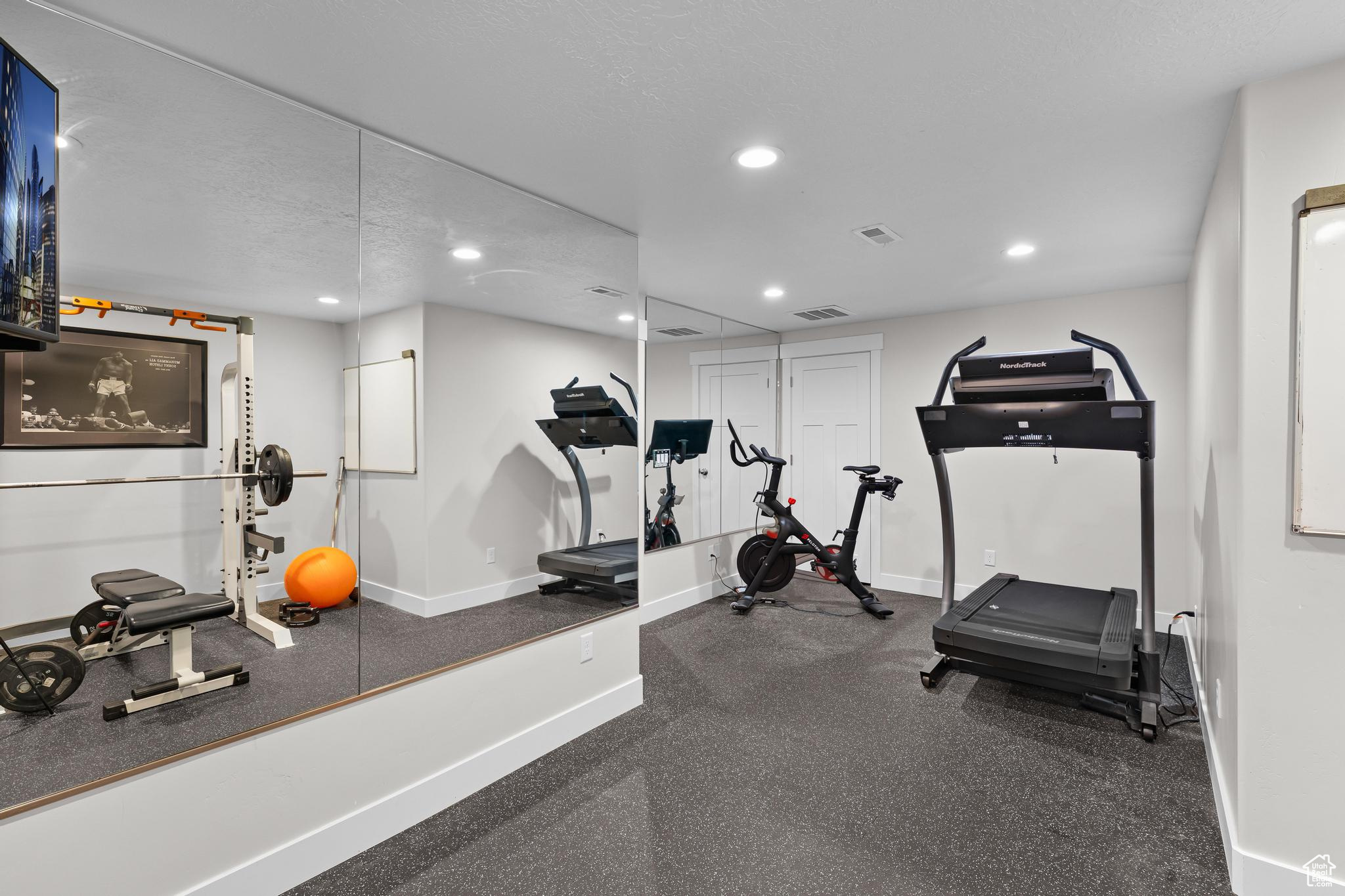 Workout room or bedroom with closet