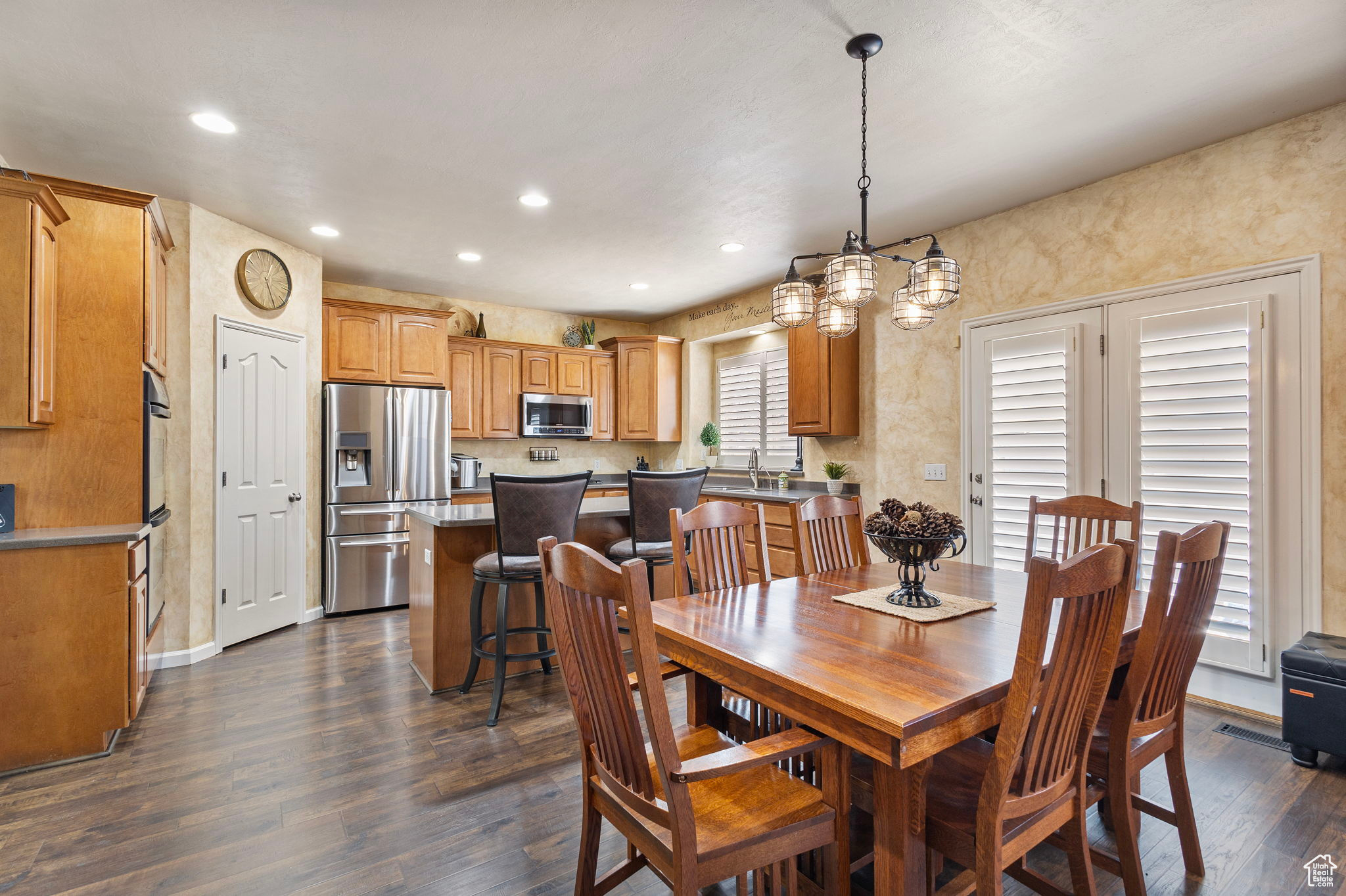Dining area with dark hardwood / wood-style flooring and sink