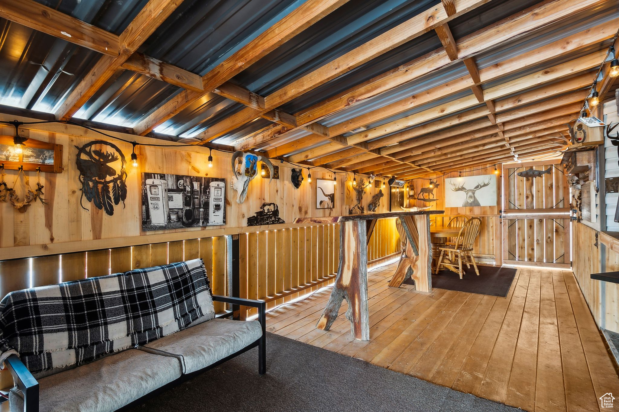 Interior space with wooden walls and wood finished floors
