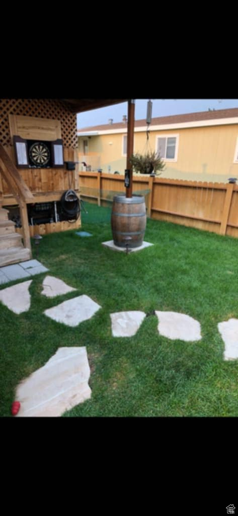View of yard featuring fence