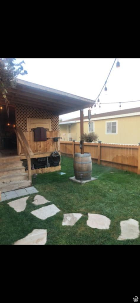 View of yard featuring fence