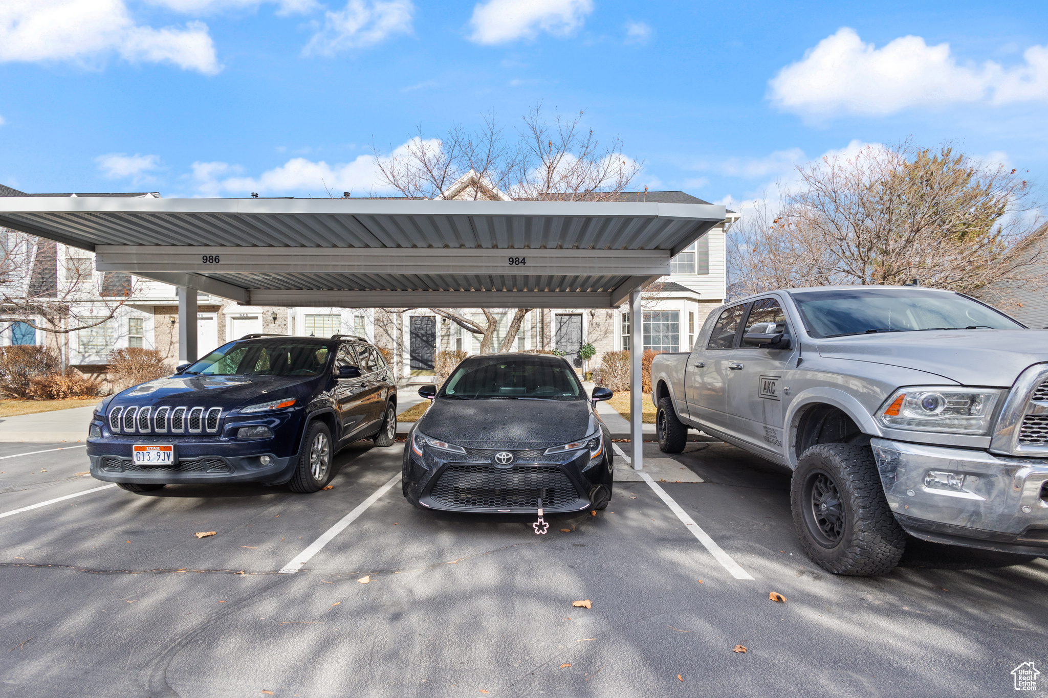 View of parking featuring a carport