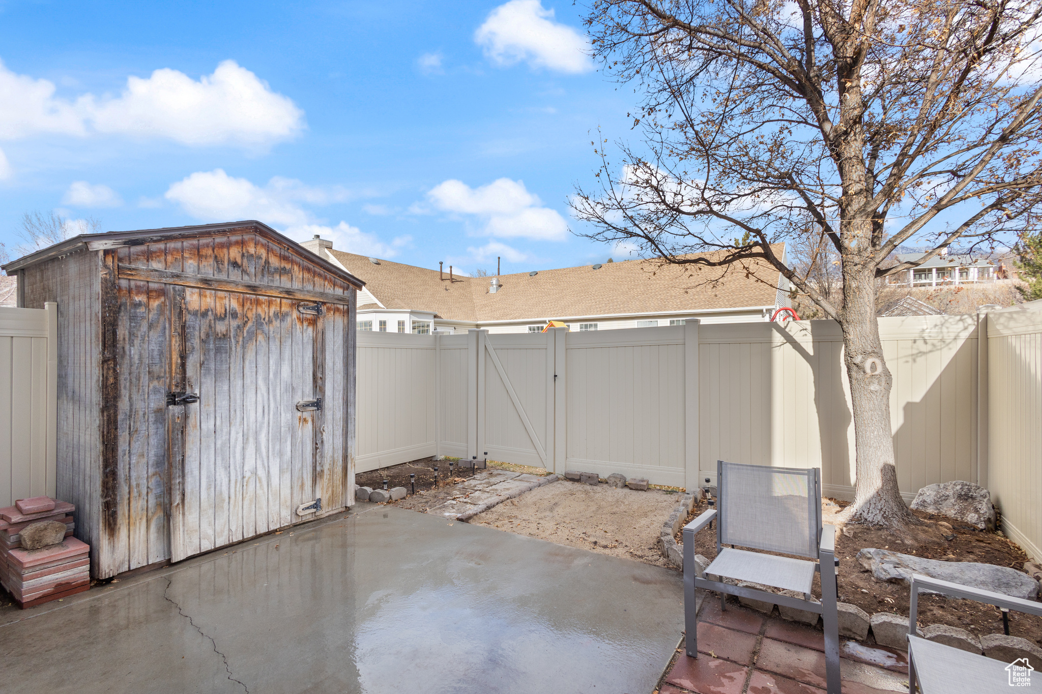 View of patio / terrace with a shed