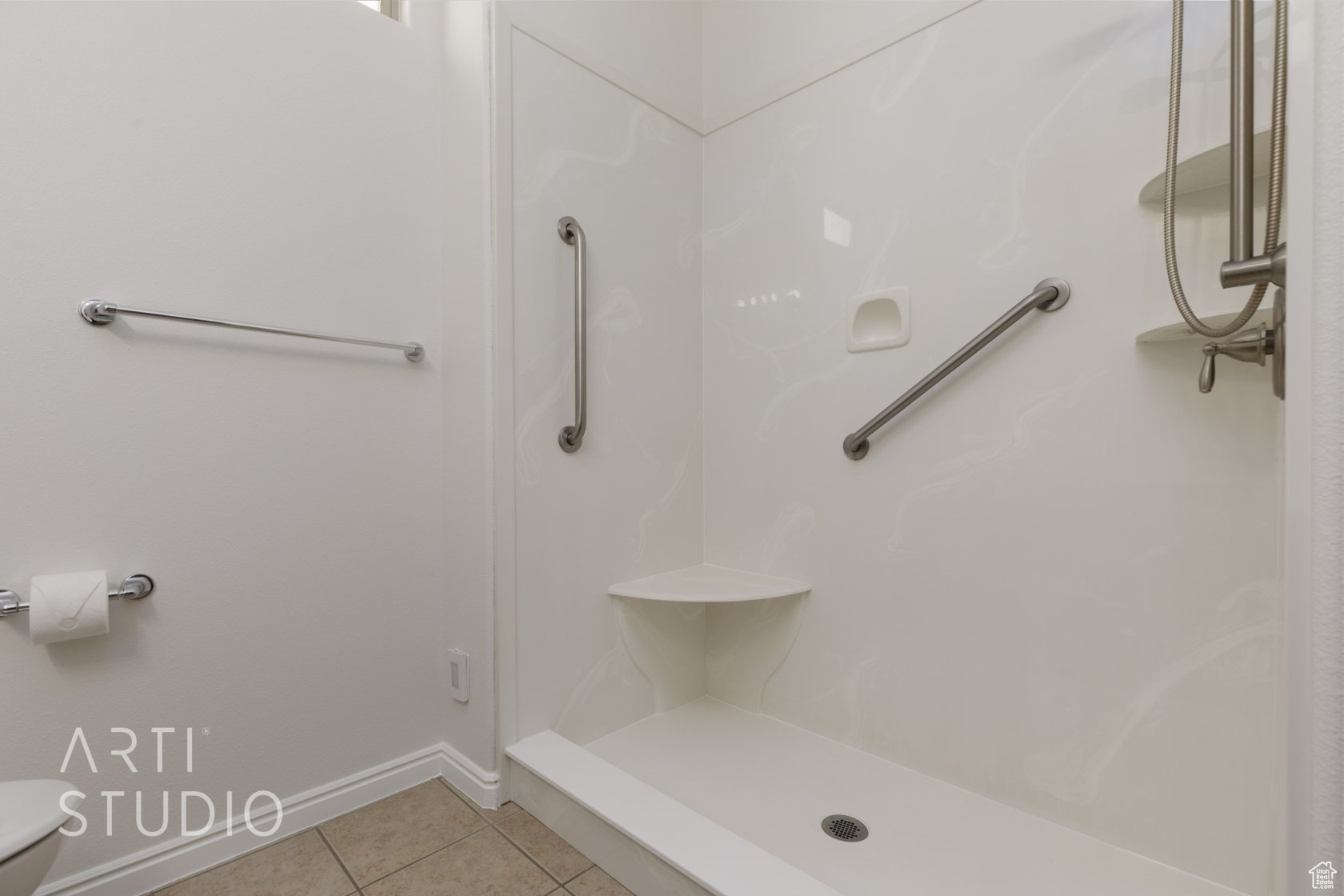Bathroom with tile patterned floors and walk in shower