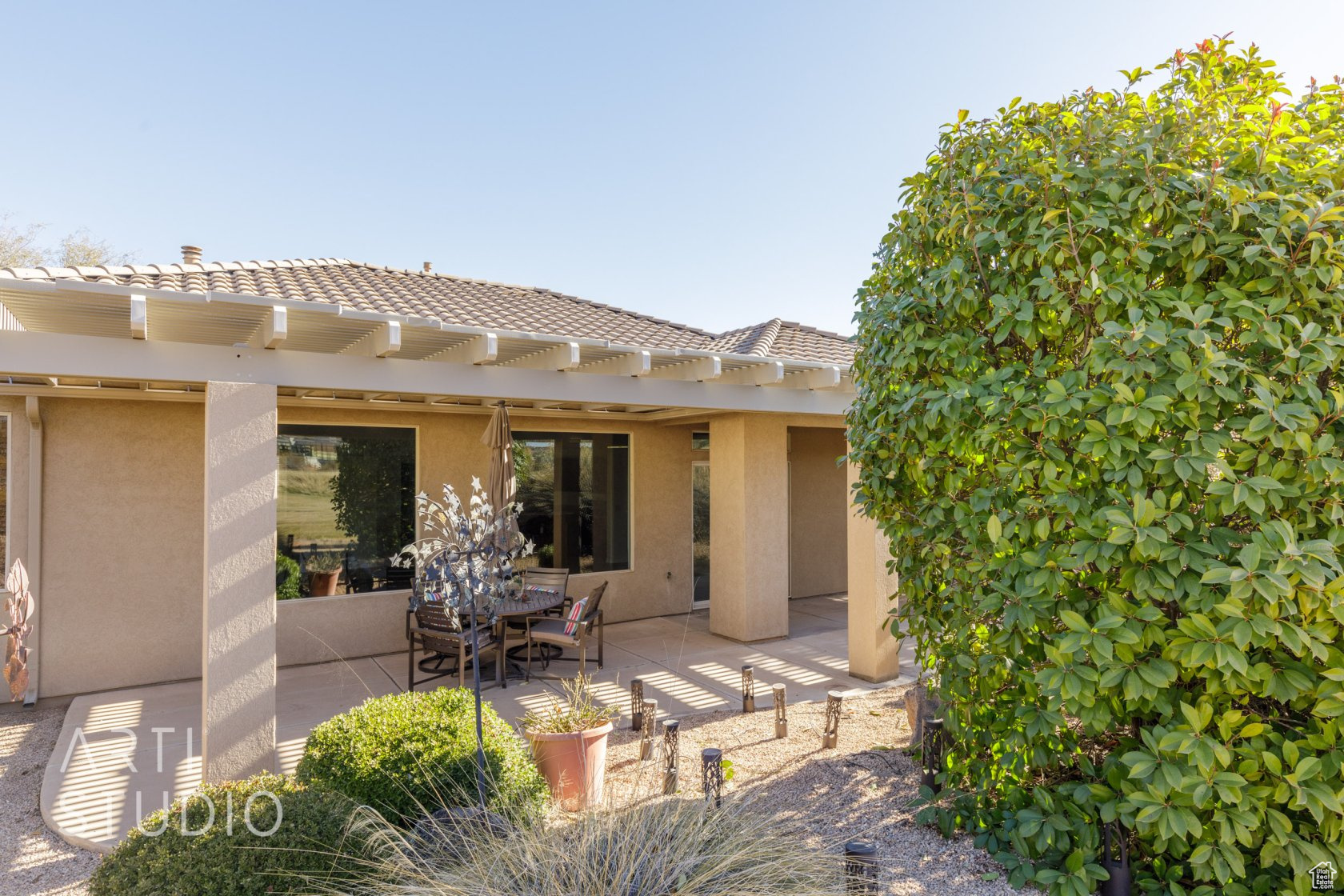 Rear view of house featuring a patio area